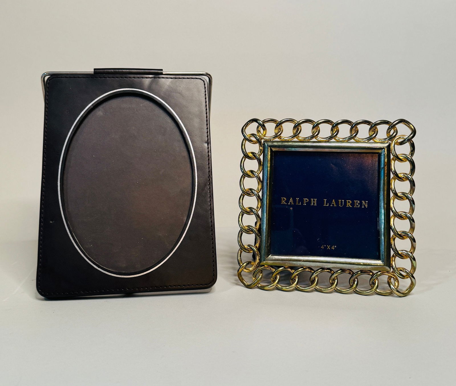 Ralph Lauren Picture Frames (2): Ralph Lauren marks on back the brass link frame for 4 x 4 inch photo the leather frame h: 8 x w: 6 inches (overall) for 6 x 4 inch photoCONDITION: brass link frame is tarnished the leather has a small