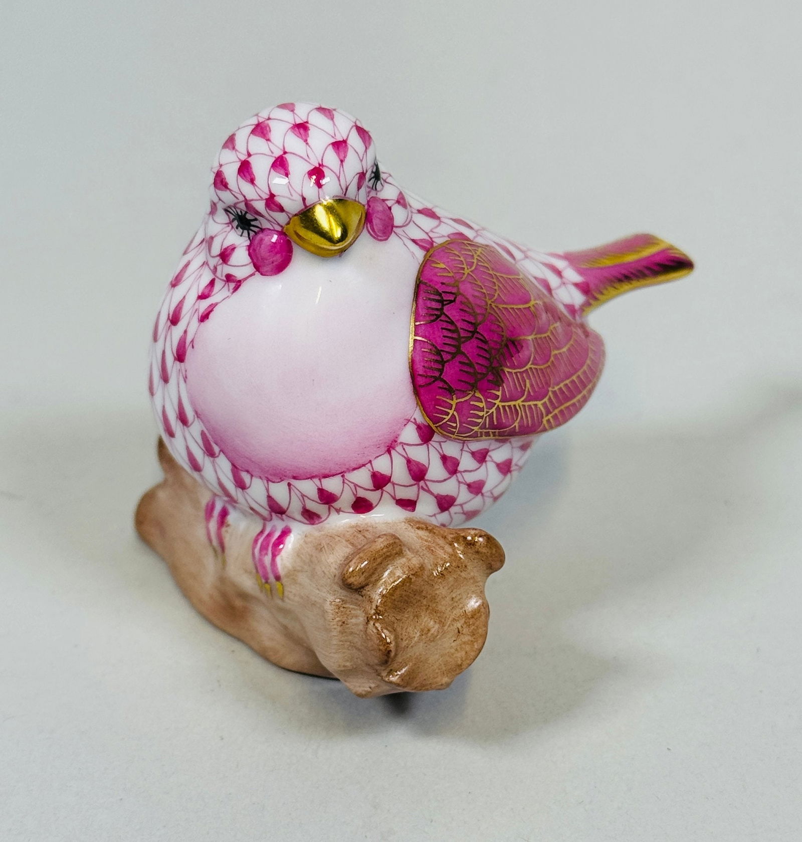 Herend Little Bird On Holly Porcelain Figurine In Raspberry Fishnet Pattern: H: 2 1/2 x w: 3 x d: 2 1/2 inches