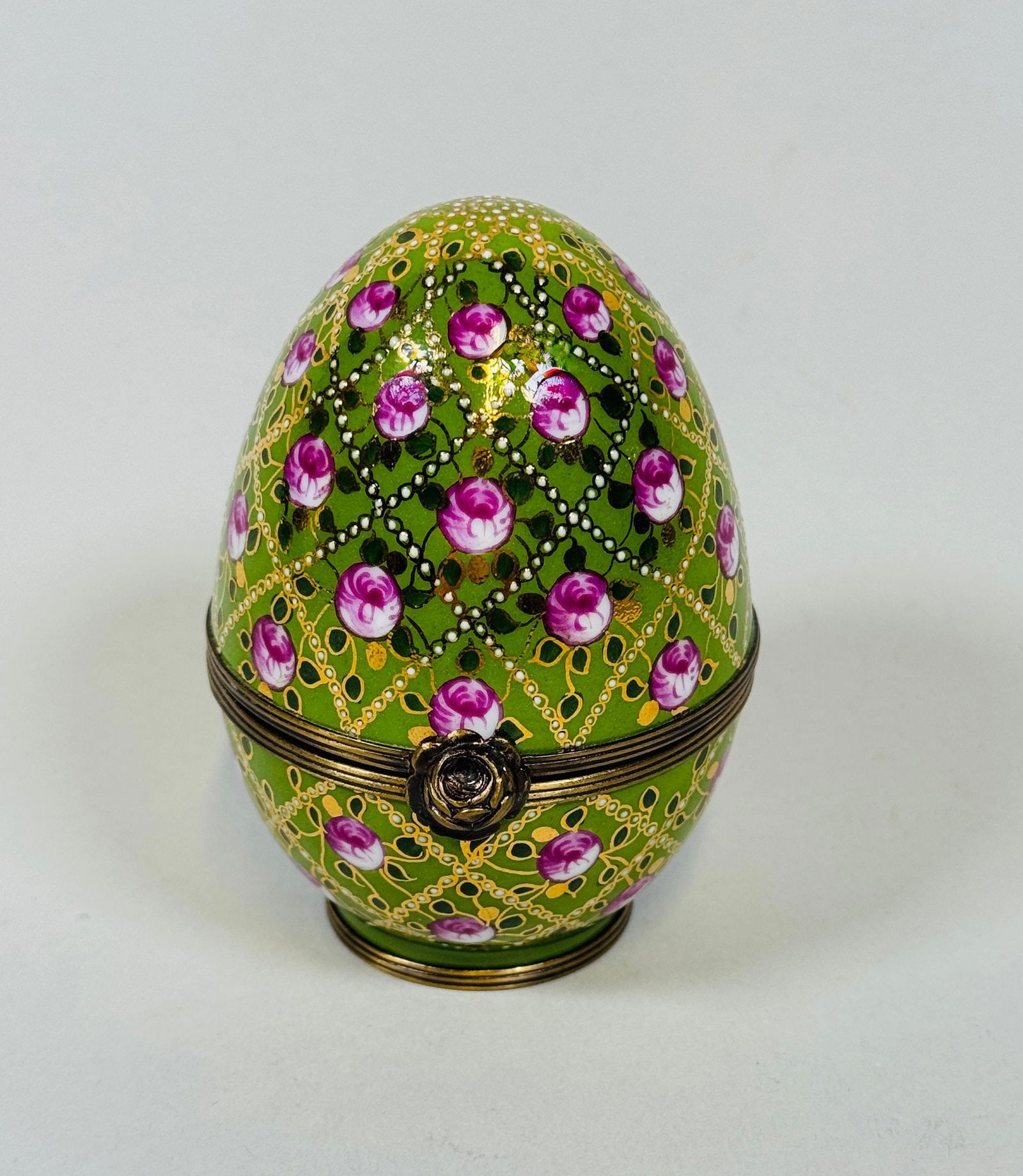 Faberge Egg: Handpainted Imperial Rose Trellis Design - 1907, After The Original: H: 3 1/2 inchesInscribed inside: Imperial Rose Trellis Egg 1907Inscribed underneath: Peint main été Limoges France. Faberge. Serie Limitee No. 266