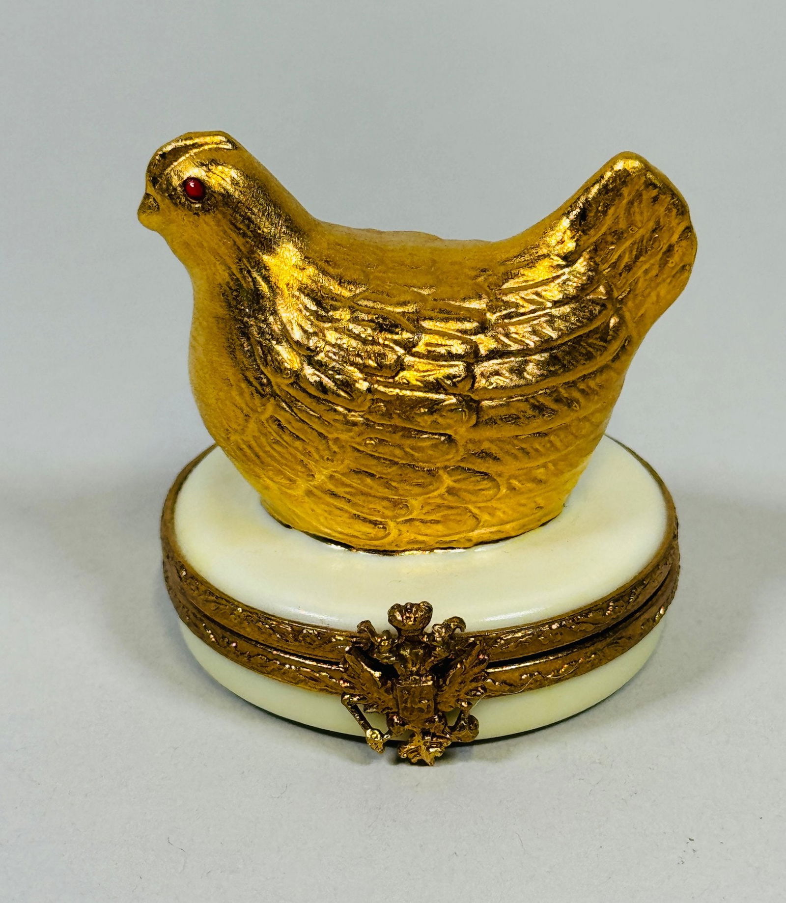 Faberge Limoges Hand Painted Porcelain Box Of A Gilt Hen: marked underneath h: 1 3/4 x dia: 1 1/2 inches