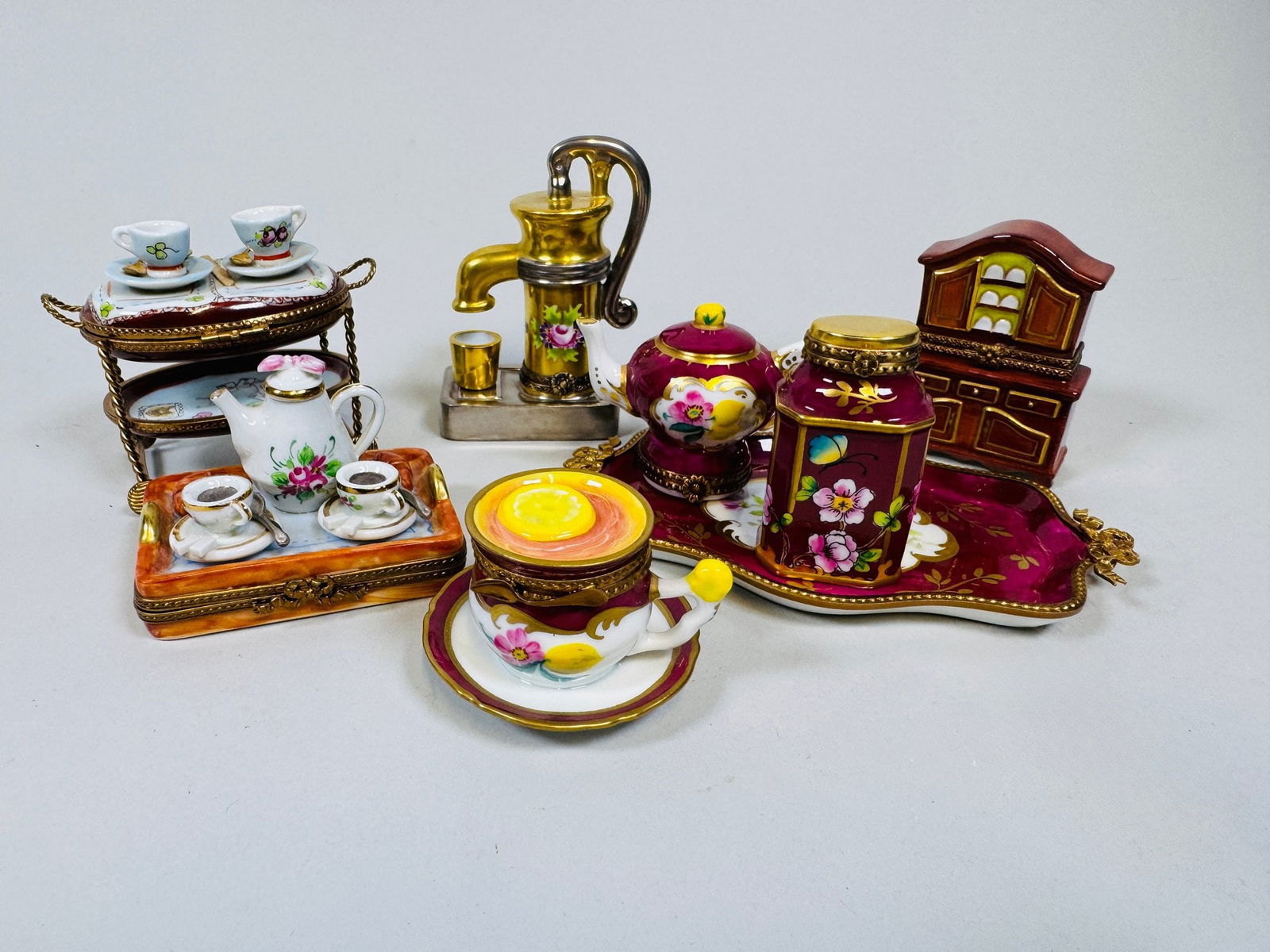 Collectiom Of Teatime Themed Rochard Limoges Hand Painted Porcelain Boxes (8): all marked the rose colored tray w: 5 1/4 x d : 3 1/4 inches ; the tea cart h: 2 3/4 inches