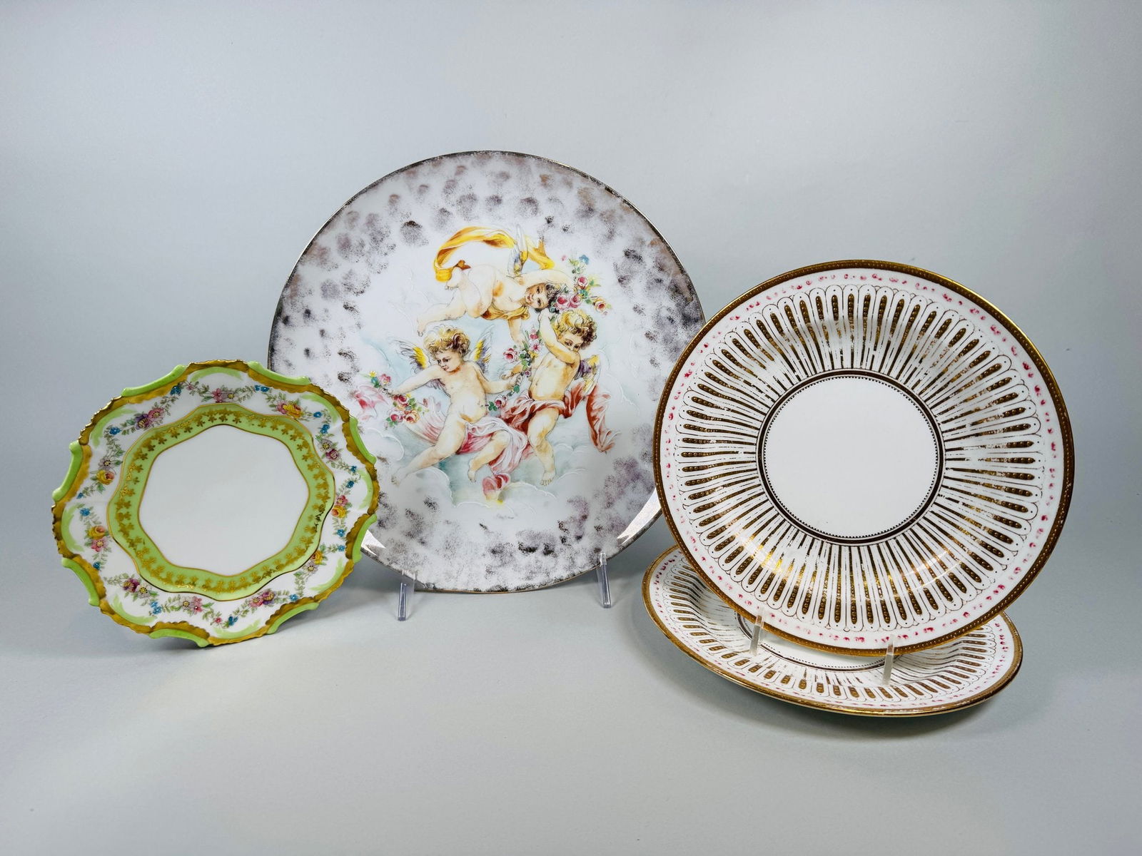 Collection Of Vintage Decorative Plates: Cauldon, England Limoges, France Schumann, Bavaria (4): pair of Cauldon plates dia: 8 inches; Limoges with green and white ground with floral garland dia: 6 1/2; putti plate 10 1/2 inches