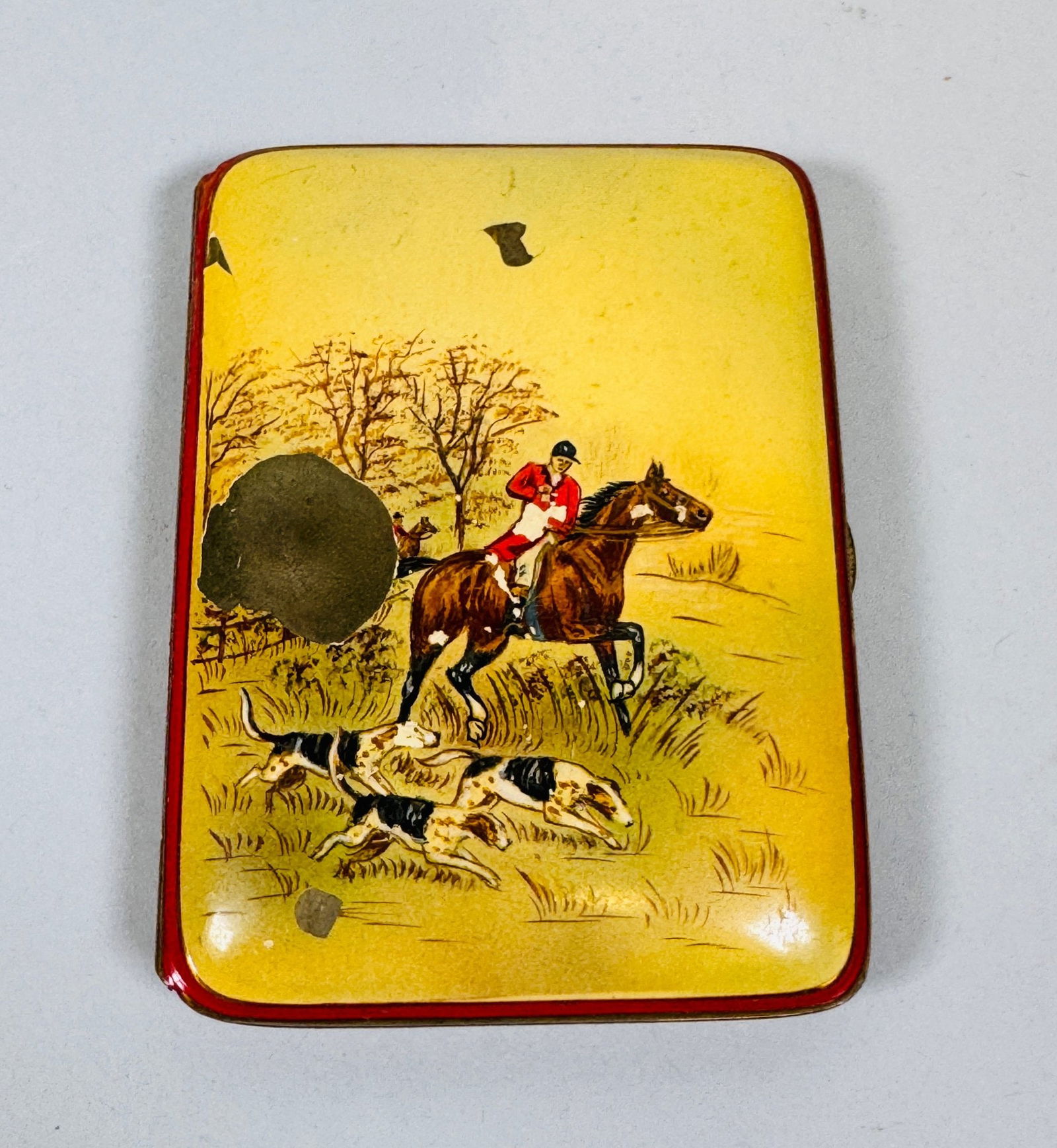 German Metal Dogs On The Hunt Scene Cigarette Case: H: 3 1/4 inches x w: 2 1/2 inches x d: 1/4 inchCONDITION: Paint loss on front