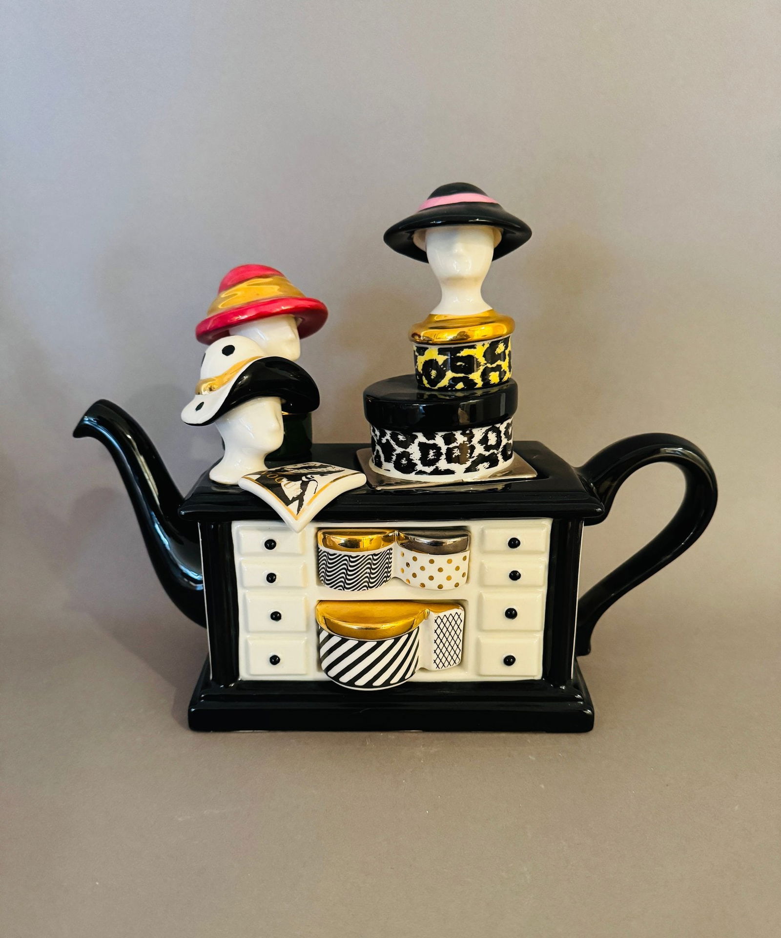 Tony Carter Hat Shop Collectable Teapot: H: 9 3/4 inches x w: 11 1/2 inches x d: 5 inchesSigned underneath and numbered 97 out of 650