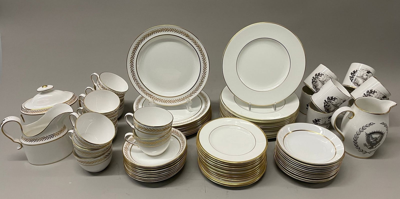 Carborundum Museum Of Ceramics Spode 1800 Reproduction Gold And White Porcelain Part Service, 77: circa 1970s Leaf Border: 9 cups 1 covered sugar 1 creamer 10 saucers 10 lunch plates; Plain Gilt: 11 saucers 12 lunch plates 14 bread and butter plates; Printed Pieces: 8 cups 1 medium sized pitcher