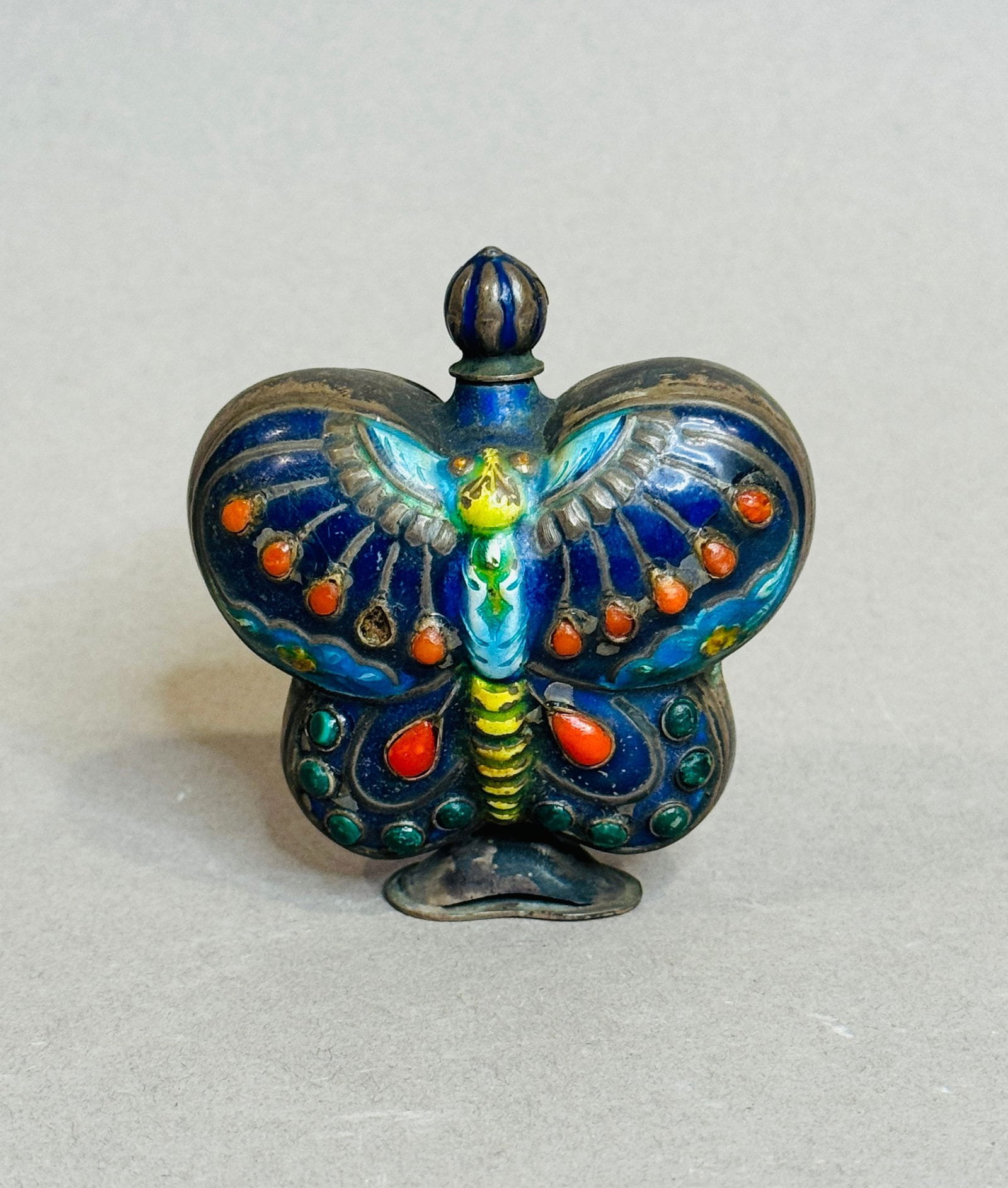 A Qing Dynasty Butterfly Form Snuff Bottle With Enamel And Semiprecious Stones: h: 2 1/2 inches CONDITION: Some of the inset stones are chipped or missing