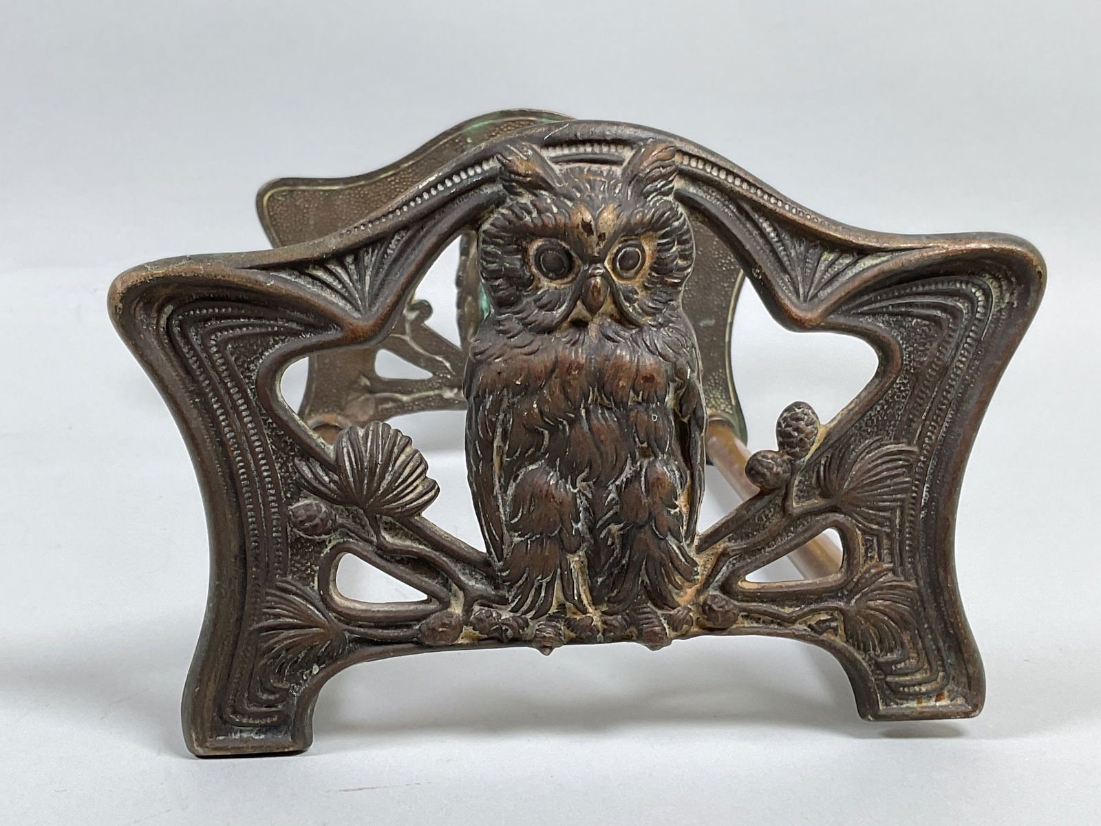 HL Judd Co (Attributed) Art Nouveau Cast Brass Book Rack With Owl Motif, C. 1910-1930: expandable numbered 9776 h: 4 1/2 x w: 9 1/2 - 15 1/2 x d: 6 1/2 inches CONDITION: oxidation and discoloration/light rust