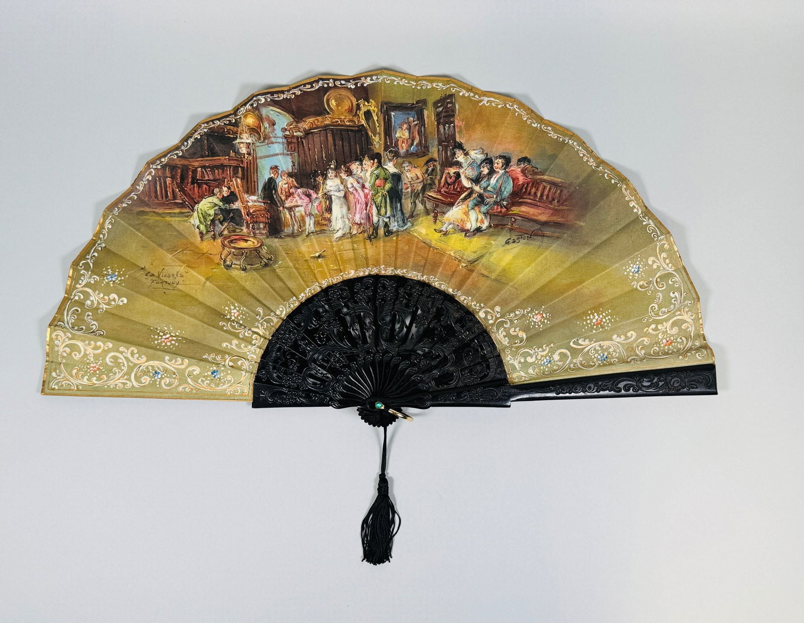 Spanish Carved And Painted Hand Fan: The image after the Maria Fortuny painting 'La Vicaria' and signed at middle right Gaston h: 12 x w: 22 (fully extended)