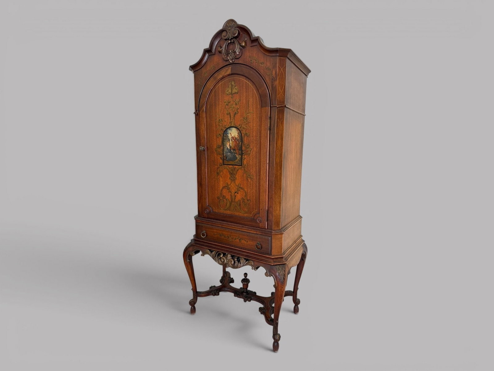 Continental Carved & Painted Tall Cabinet, Late 19th/Early 20th Century: interior has been fitted as a stereo or entertainment cabinet having a single door over a singe drawer H: 69 w: 27 d: 18 inches CONDITION: Sun damage to one side holes in back for electric cords