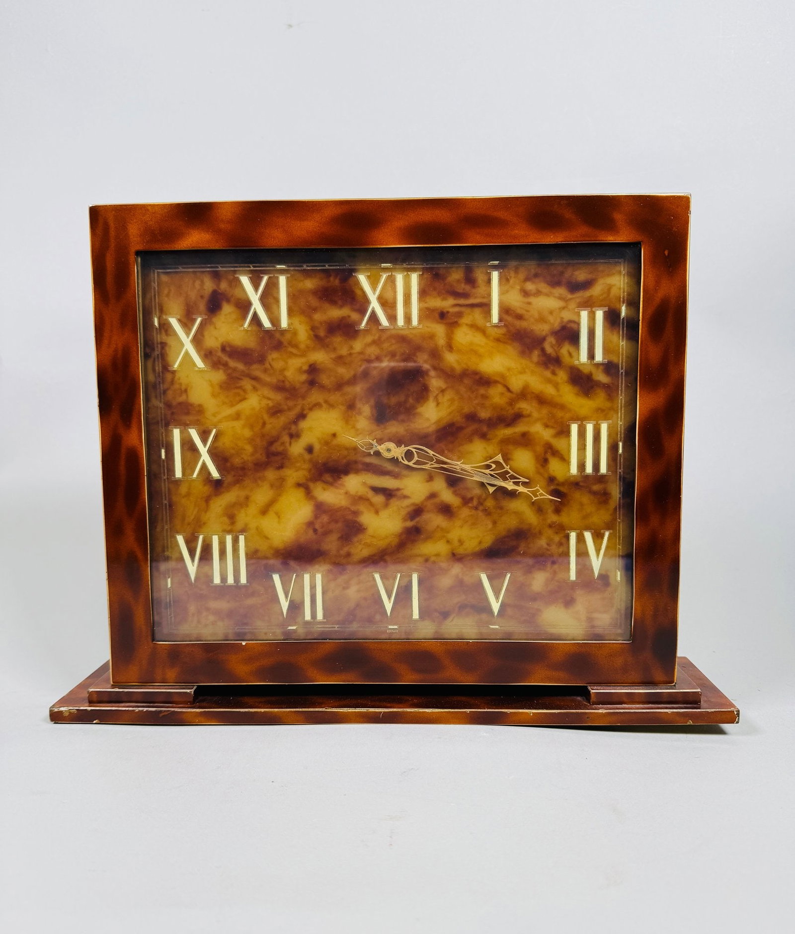 German Art Deco Faux Tortoiseshell Veneered Mantel Clock, C. 1920: H: 9 1/2 x W: 12 5/8 x D: 2 7/8 inchesCONDITION: veneer flaking particularly to back not in working order