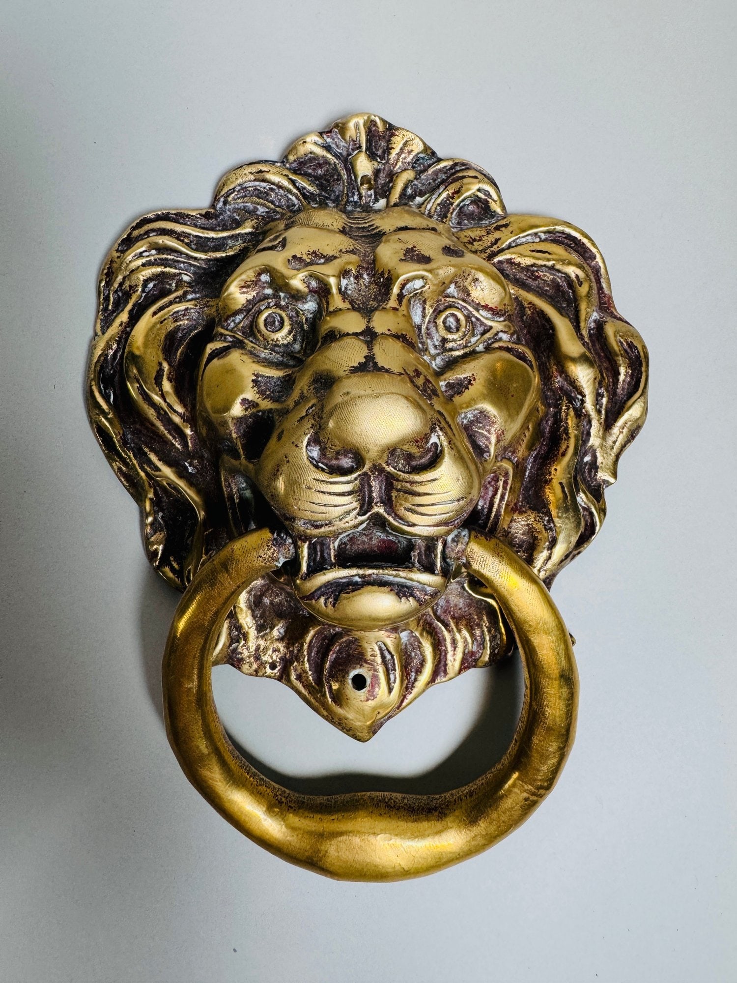 Cast Brass Lion Head Door Knocker: H: 10 x w: 8 x d: 4 inchesCONDITION: Good weight and nice patina some traces of old red paint along the bottom excellent condition
