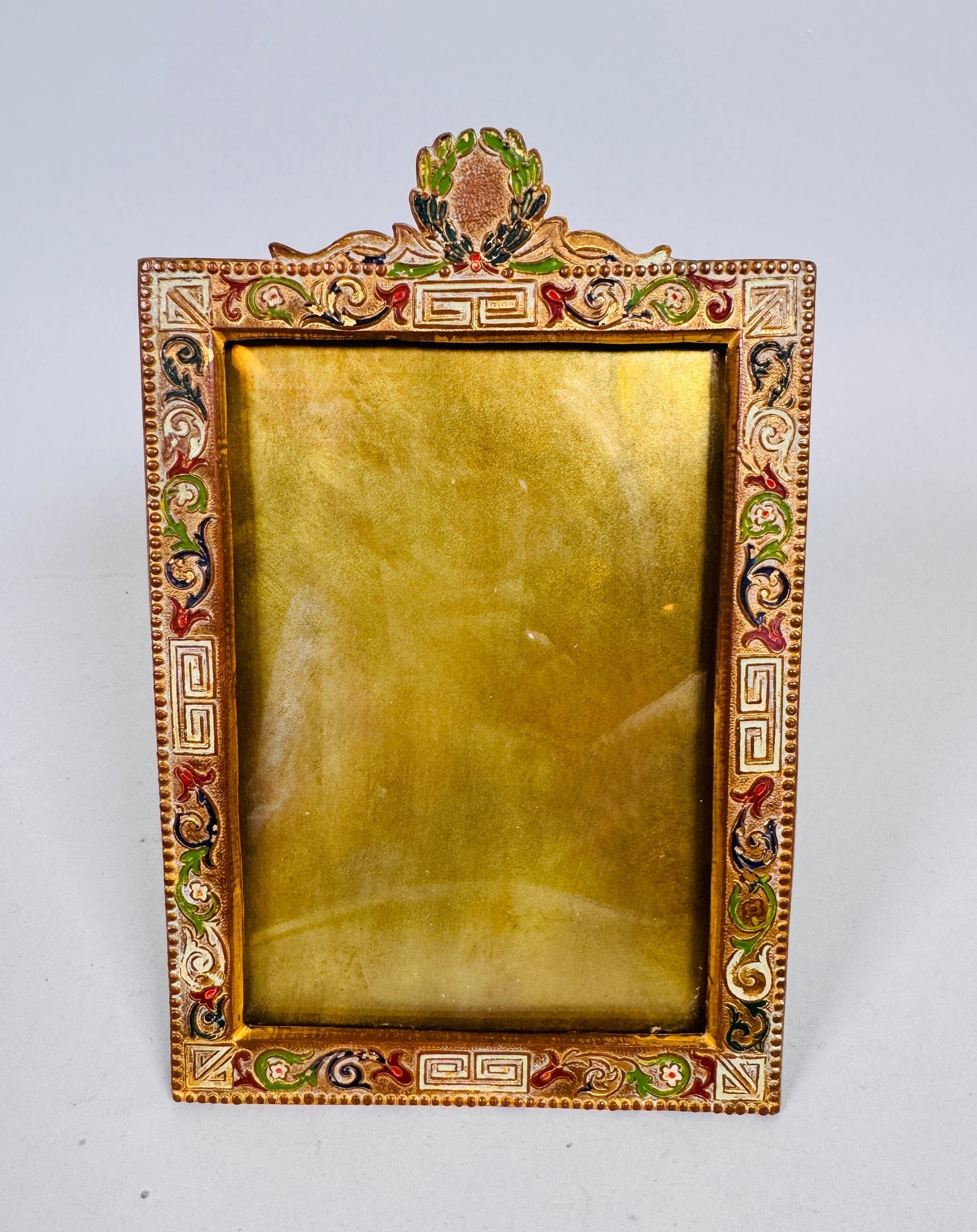 Art Metal Works (Newark, NJ) Aesthetic Style Enamel And 24K Gold Plated Picture Frame, C. 1897: stamped on back h: 7 x w: 4 1/2 (overall) h: 5 x w: 3 1/2 inches (opening)CONDITION: minor light wear to surface consistent with age and use