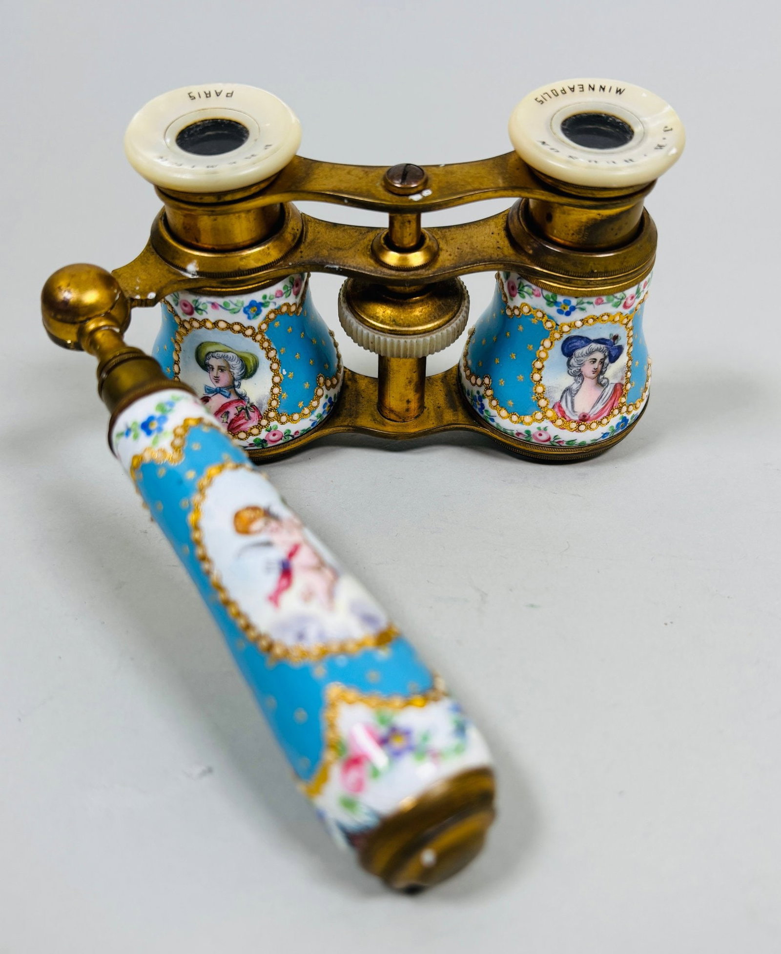 Premier Paris Brass, Enamel And Mother Of Pearl Opera Glasses, Late 19th-early 20th Century: The eyepieces marked J.B. Hudson/Minneapolis Premier/Paris monogrammed NLC at nosebridge with telescoping folding handle w: 4 inches CONDITION: lenses need cleaning minor enamel damage on handle consi