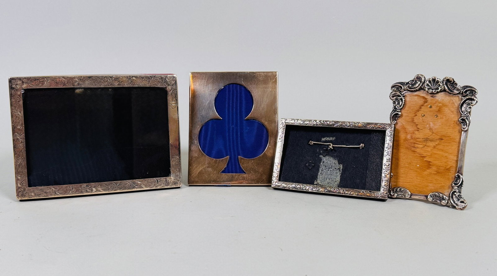 Collection Of Antique Sterling Silver Picture Frames (4): All stamped; the smallest h: 2 3/4 x w: 4 1/4 inches the largest h: 4 1/4 x w: 6 inches CONDITION: one frame is missing glass some surface scratches otherwise in good condition OZT: 5.6 (weighable)