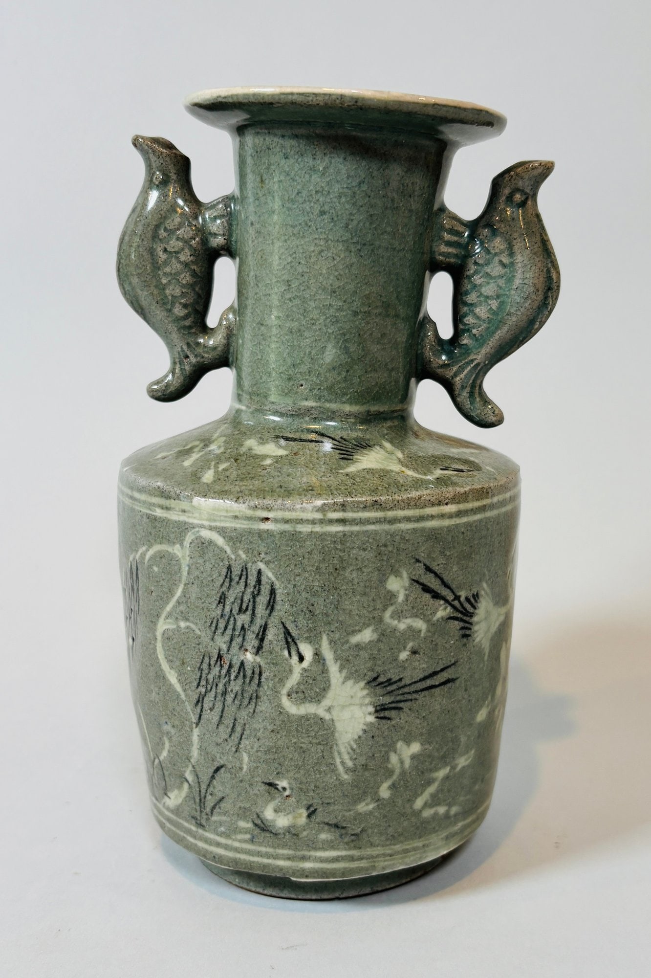 Korean Inlaid Celadon Vase With Twin Fish Handles: with twin fish form handles and inlaid crane on body and retaining original retail sticker of Bluett & Sons/London under foot h: 7 x dia: 4 inches
