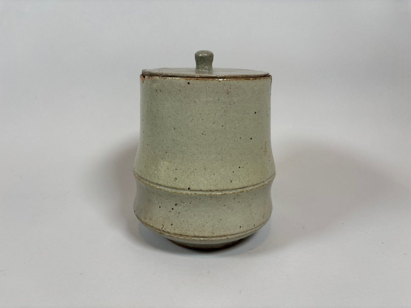 Korean Celadon-glazed Covered Cup: molded as a node of bamboo h: 7 1/2 x dia: 6 inches CONDITION: chips around rim and edge of lid