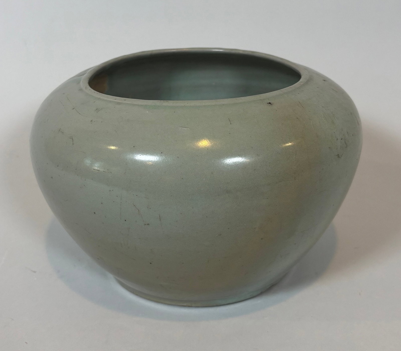 Korean Celadon Glazed Ovoid Jar: h: 5 3/4 x dia: 9 inches CONDITION: one visible hairline crack from rim down side of jar
