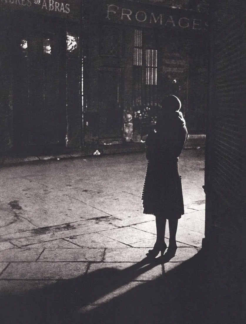 BRASSAI - Young Prostitute at Rue de la Reynie, Paris: Young Prostitute at Rue de la Reynie, ParisPhoto-litho, c. 1980'sDimensions: 9.5 x 7.5 inchesWork is mounted