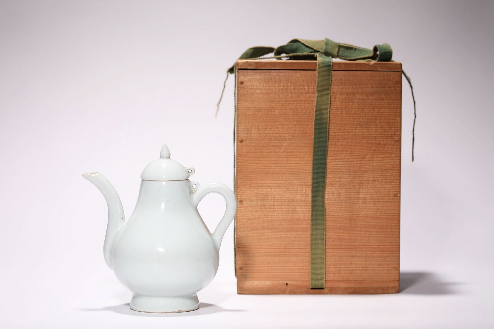 A CHINESE CELADON-GLAZED PORCELAIN SMALL TEAPOT (1 of 12)