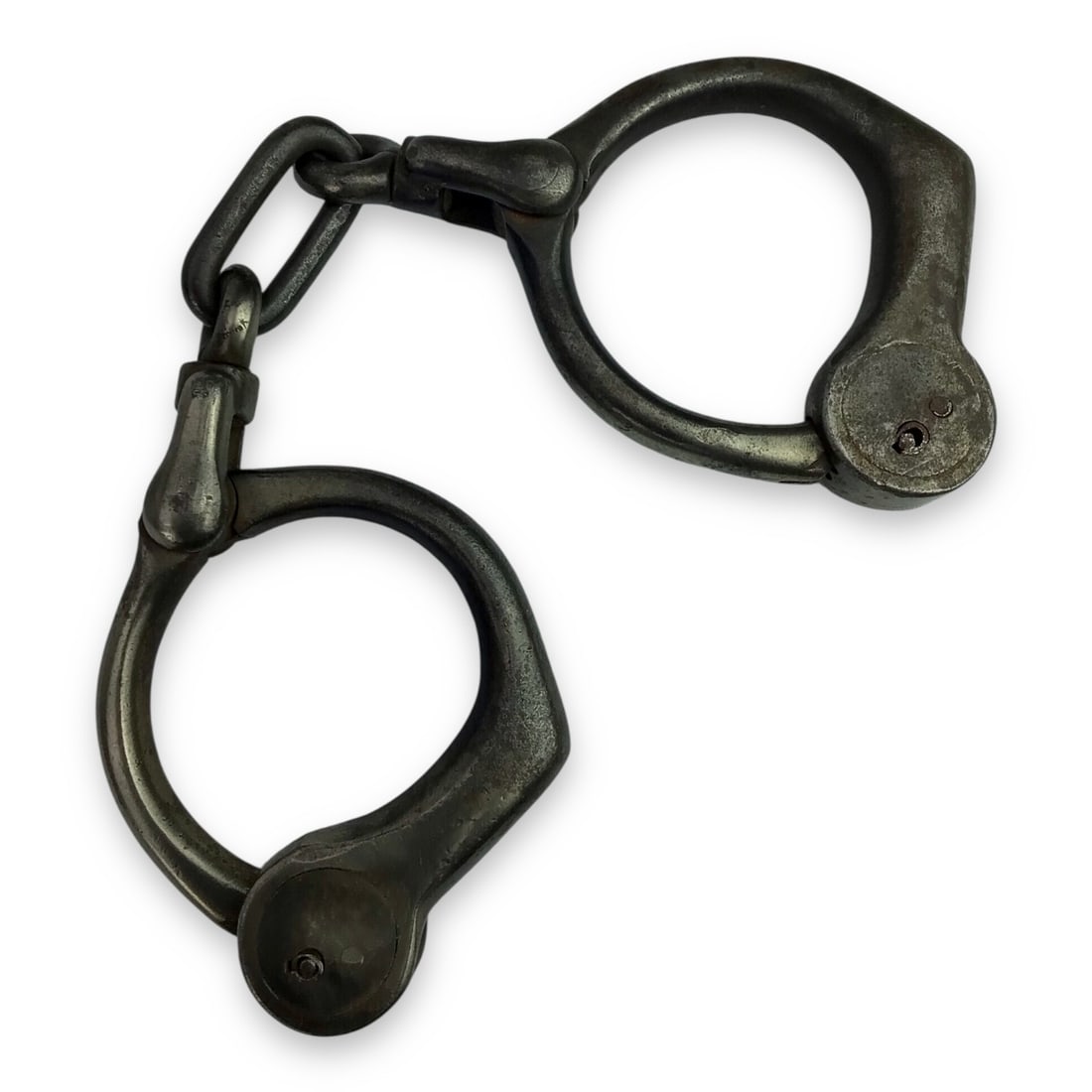 Antique Tower Bean's Pattern Handcuffs – Pat. May 2, 1899 – Great Provenance: An original pair of Tower Bean’s Pattern handcuffs, patented May 2, 1899. These early law enforcement restraints measure approximately 10 1/8" across from cuff to cuff and reflect the robus