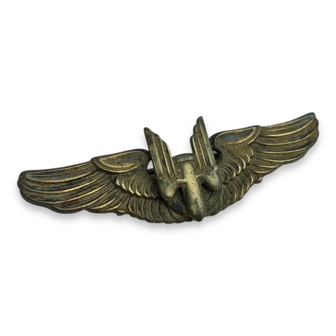 U.S. WW2 Gemsco Aerial Gunner Evening Dress Miniature Wing: This is a U.S. Army Air Forces Aerial Gunner miniature wing, produced by Gemsco during World War II for wear with evening dress or formal military attire. Struck in silver-tone metal, the wing feature