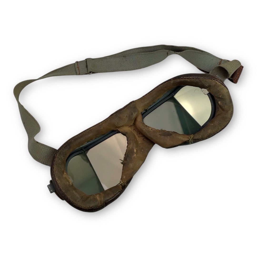British WW2 RAF Pilot Goggles - Tinted Lenses, Complete Leather & Strap: An uncommon set of WWII-era Royal Air Force pilot goggles, featuring tinted side-vision lenses, leather frame in excellent condition, and original adjustable head strap still intact and functional. Th