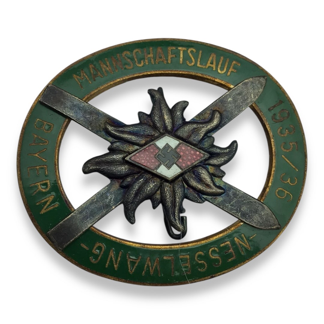 German WW2 Hitler Jugend Ski Badge Mannschaftslauf 1935-36- Nesselwang-Bayern: This is a rare and beautifully constructed 1935–36 Hitler Youth Ski Competition Badge, awarded for the Mannschaftslauf (team ski race) held in Nesselwang, Bavaria. Multi-piece in design, the badge s