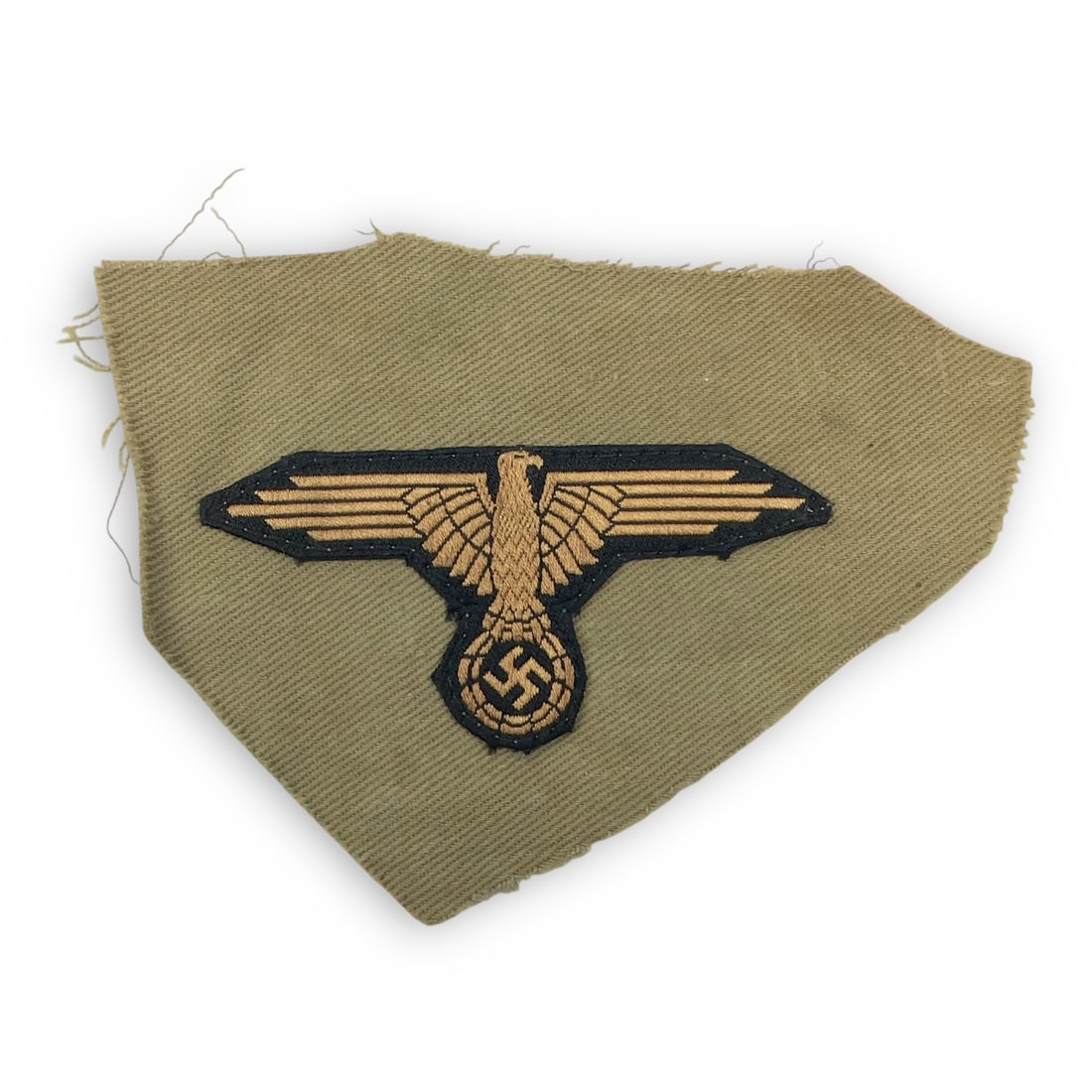 German WW2 Rare Waffen-SS Afrika Korps Tropical Sleeve Eagle – Uniform Removed: This is an original WWII-era Waffen-SS tropical sleeve eagle, machine-embroidered on tan cotton and removed from a tropical field tunic. The eagle is rendered in light grey thread on a khaki backgroun