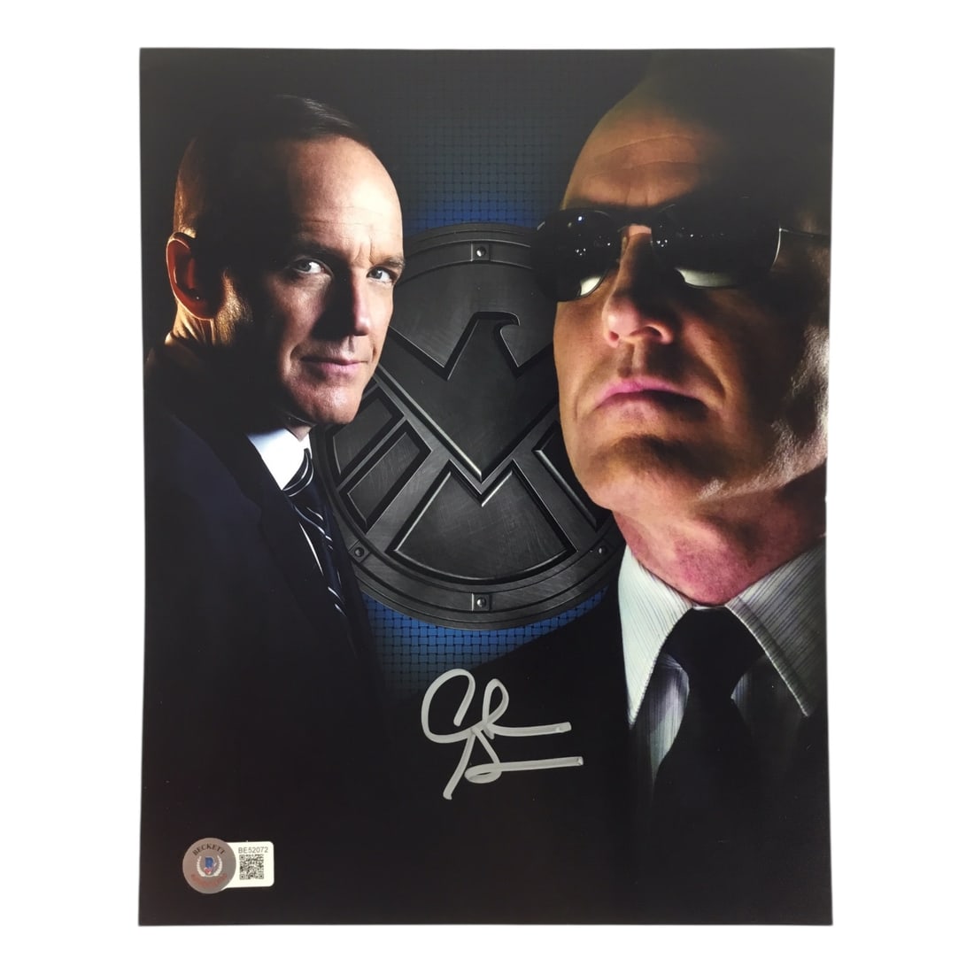 Clark Gregg Signed 8x10 Avengers Photo (Beckett Certified): This signed 8x10 photograph features Clark Gregg in his role as Agent Phil Coulson, the steadfast and beloved S.H.I.E.L.D. agent whose sacrifice helped unite Earth's mightiest heroes in The Avengers.