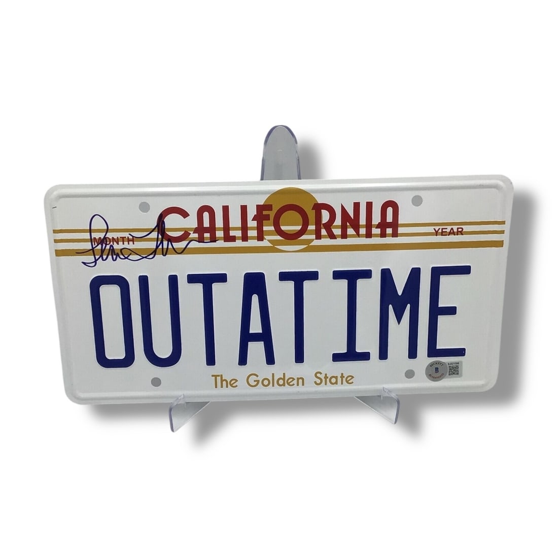 Back to the Future - "OUTATIME" License Plate | Signed by Lea Thompson w/ COA: Great Scott.. don't miss this one! Straight from the heart of Back to the Future nostalgia comes this "OUTATIME" license plate, signed by Lea Thompson herself, the unforgettable Lorraine Baines