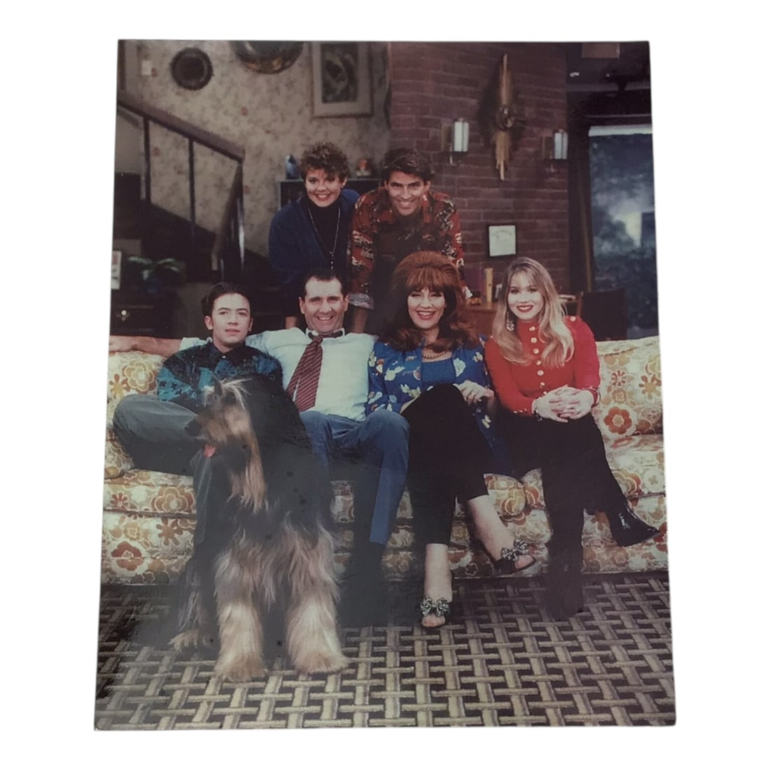 Married With Children Cast Signed Photograph: Here is a true rarity for television collectors, a complete cast-signed photograph from the iconic sitcom Married With Children. This remarkable piece bears the signatures of all the principal cast me