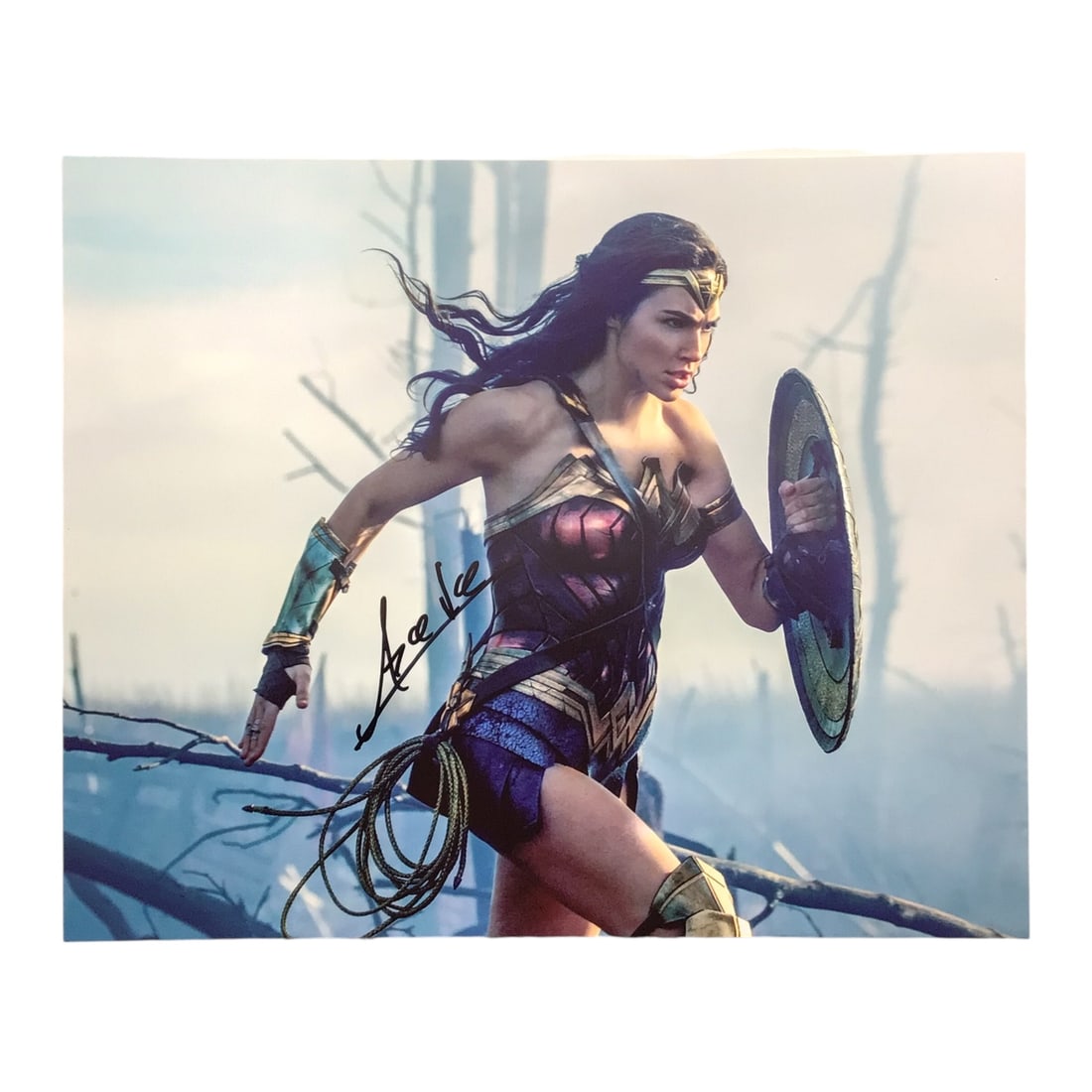 Gal Gadot Signed Wonder Woman Photograph with COA: Step into the world of superheroes with this signed 8x10 photograph of Gal Gadot as Wonder Woman, one of the most iconic portrayals of a comic book character in modern film. Gadot's autograph, boldly