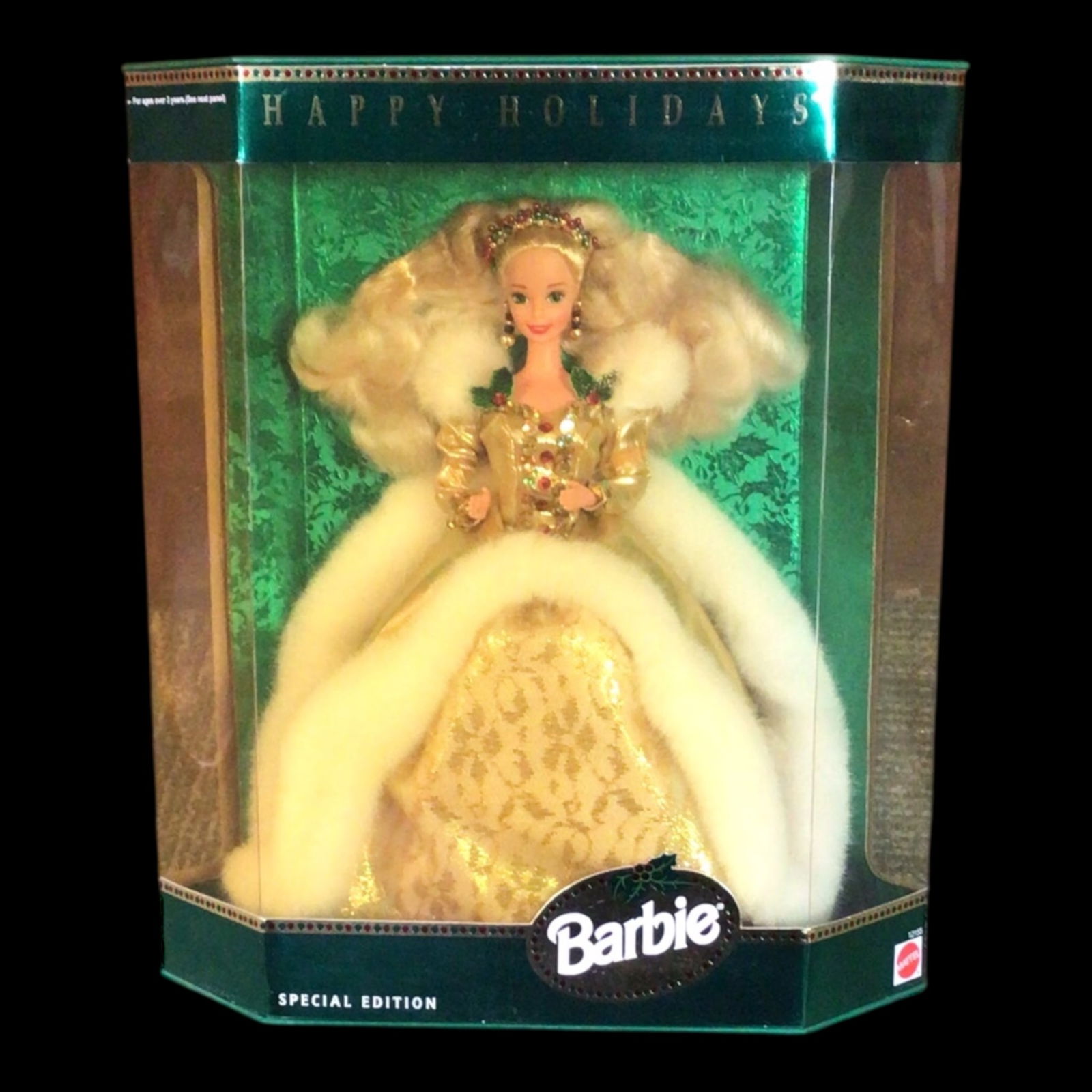 1996 Happy Holidays Special Edition Barbie Doll - NIB: Offered here is the 1996 Special Edition Happy Holidays Barbie, dressed in a glamorous gold gown trimmed in faux fur. Elegantly presented in her original unopened box, this doll exudes seasonal luxury