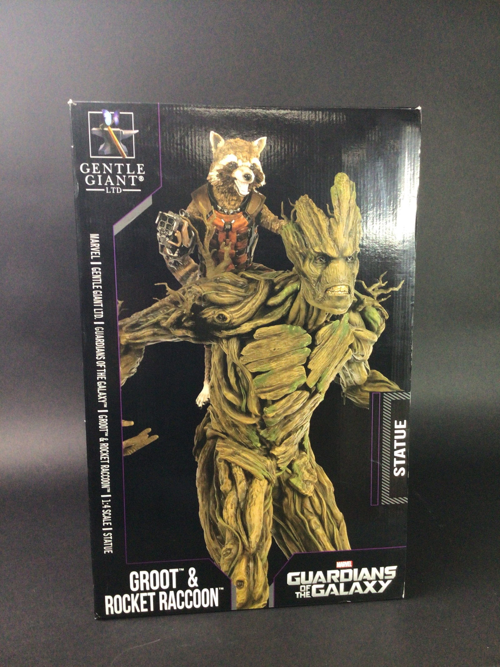 Guardians of the Galaxy Groot & Rocket Raccoon 1:4 Scale Statue: Commanding attention at over 21 inches tall, this striking 1:4 scale limited edition statue by Gentle Giant LTD brings the cosmic spirit of Guardians of the Galaxy to life in spectacular detail. Featu
