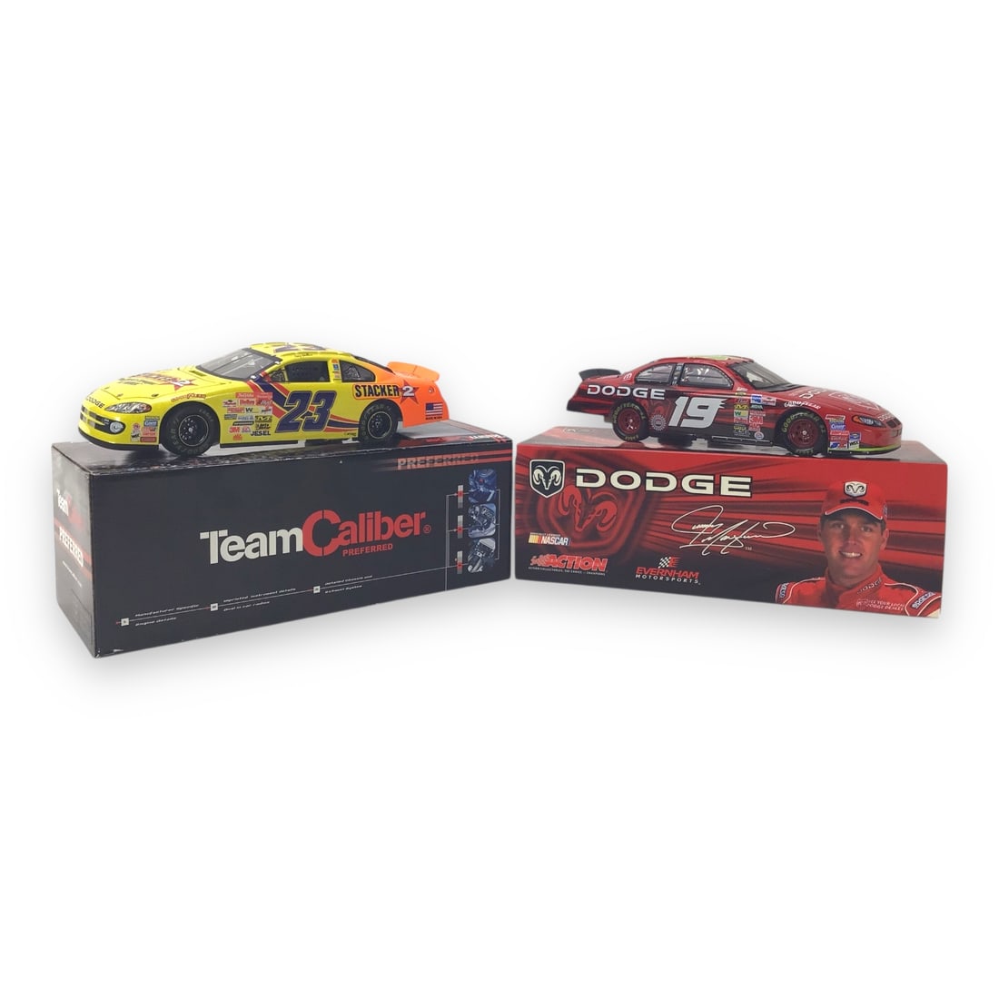 Two NASCAR Diecast Cars: #23 Stacker 2 & #19 Dodge - 1:24 Scale: This eye-catching pair of 1:24 scale NASCAR models includes two team-sponsored favorites: the #23 Stacker 2 from Team Caliber's Preferred Series, and the #19 Dodge from Action Racing Collectables.Hous