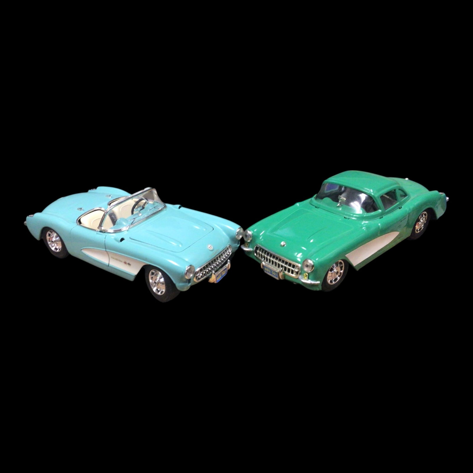 Two 1957 Chevrolet Corvette Die-Cast Model Cars: Celebrate mid-century design with this pair of 1957 Chevrolet Corvette die-cast models, capturing the curves, fins, and flair of America's first true sports car. Includes both a Light blue convertible