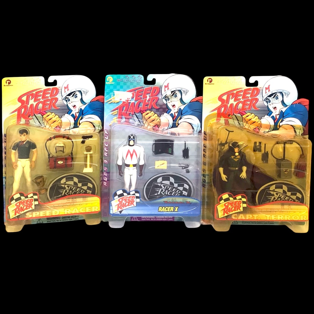 Speed Racer Action Figures by ReSaurus - Set of 3: Step back into the fast-paced world of classic anime with this trio of Speed Racer action figures by ReSaurus. The set includes Speed Racer, Racer X, and Captain Terror, each sealed in vibrant 1990s-e