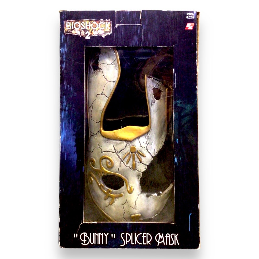 BioShock 2 Subject Omega & Little Sister Action Figure Set - Bunny Splicer Mask Edition - New in Box: An exceptional Collector's piece from the BioShock universe, this deluxe action figure set features Subject Omega alongside a Little Sister, housed in a unique dual-display box that also includes the 