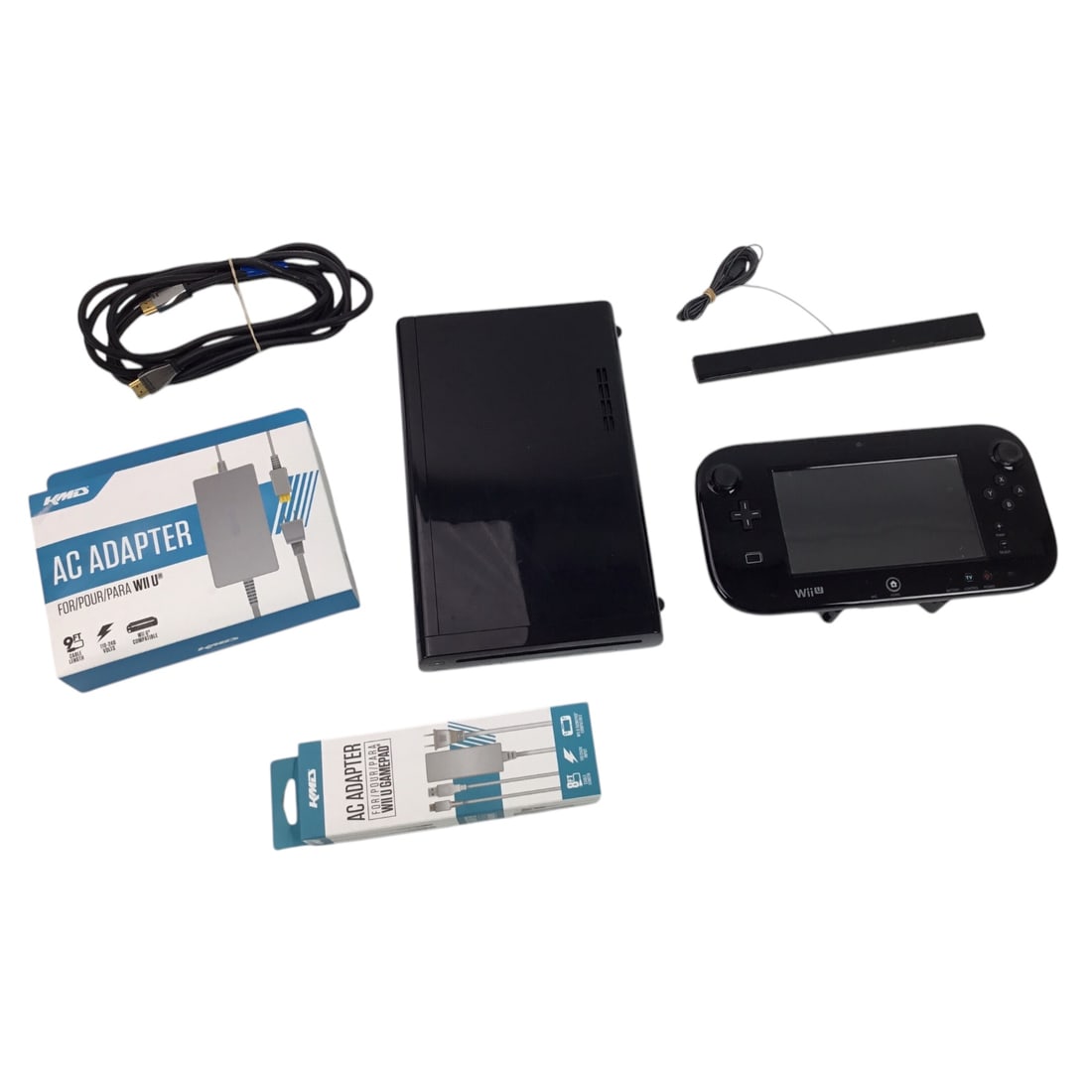 Nintendo Wii U Console - Complete: This listing features an authentic Nintendo Wii U console set, including the console, gamepad controller, sensor bar, HDMI cable, and third-party AC adapters for both the system and controller. The it