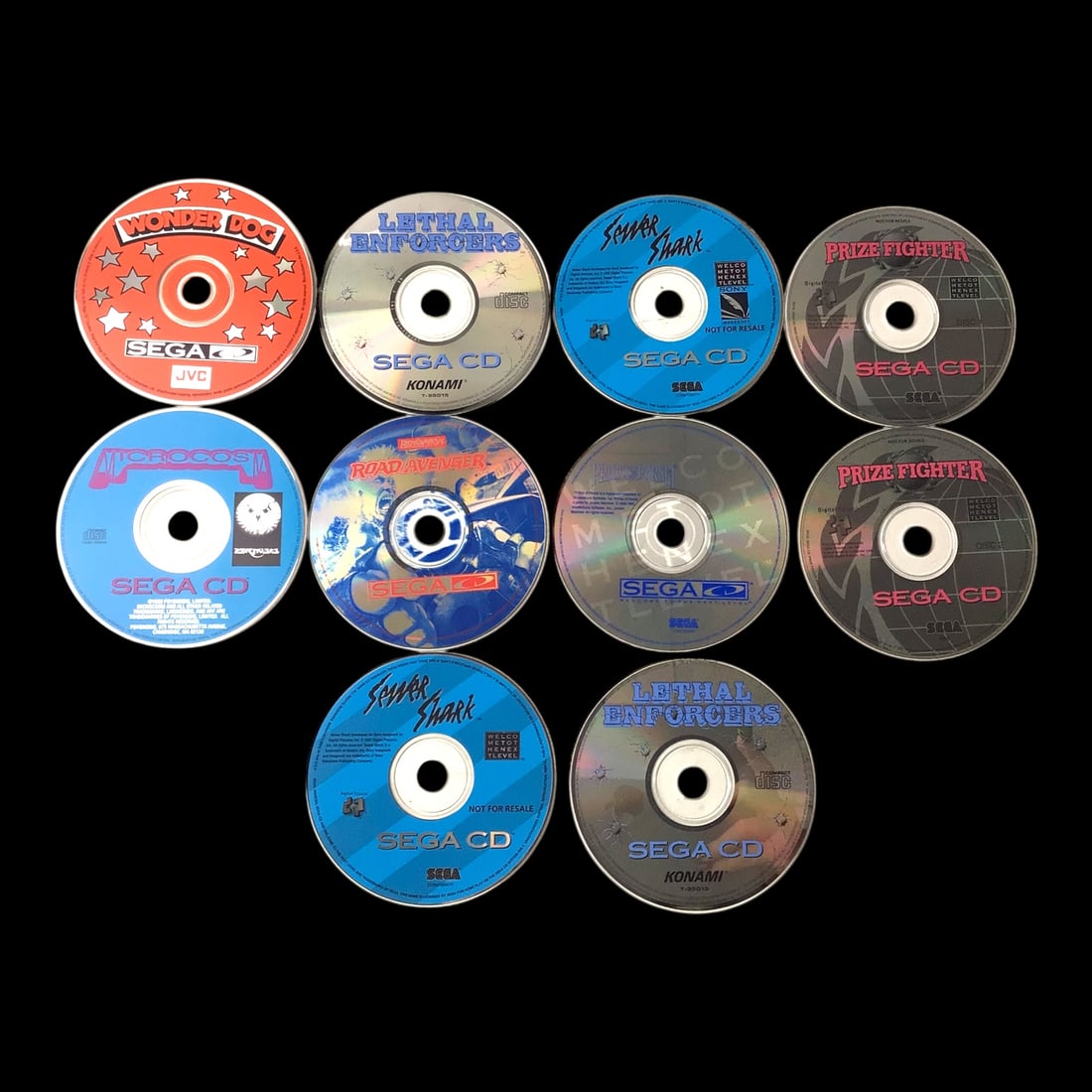Sega CD Game Collection - 10 Titles: Lot of ten Sega CD titles, showcasing the system's signature FMV-driven gameplay and action-packed catalog. Included are Wonder Dog, Lethal Enforcers, Sewer Shark, Prize Fighter, Microcosm, Road Aveng