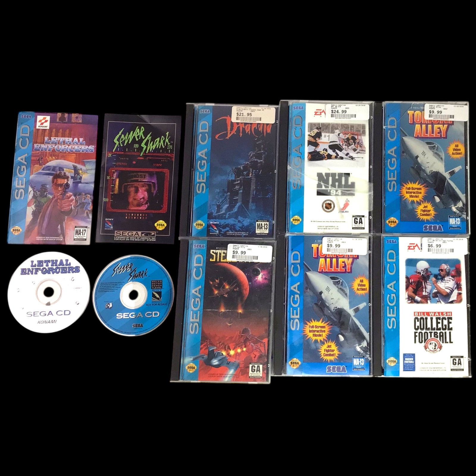 Sega CD Game Collection - 7 Titles: Lot of seven Sega CD games including Lethal Enforcers, Sewer Shark, Dracula, NHL '94, Tomcat Alley, Stellar Fire, and Bill Walsh College Football. Each title comes with its original disc and case. The