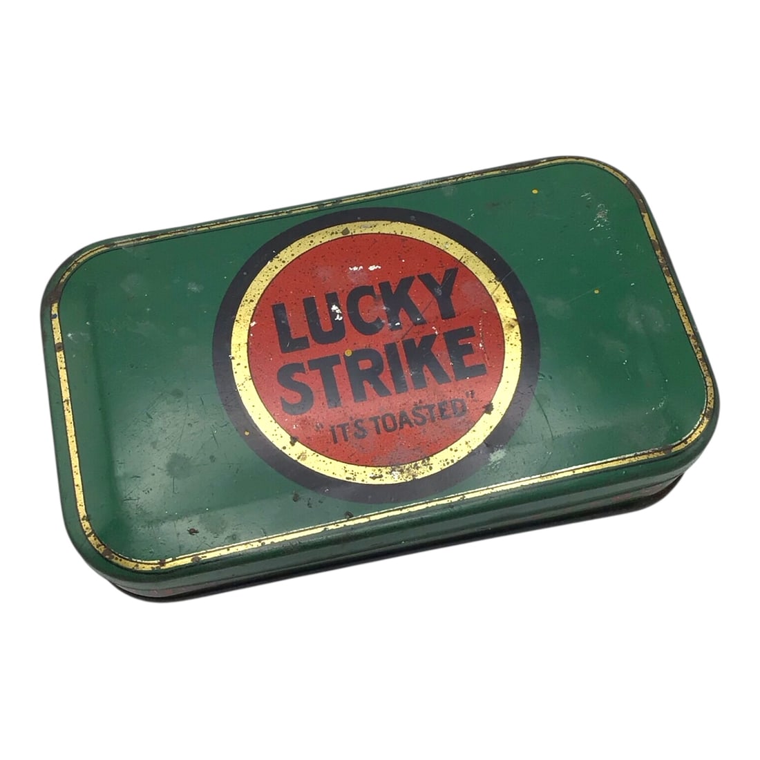 Vintage Lucky Strike "It's Toasted"? Sliced Plug Cigarette Tin: This original Lucky Strike "It's Toasted"? Sliced Plug cigarette tin is a vibrant and well-preserved example of early American tobacco advertising. The tin retains excellent original green and red col