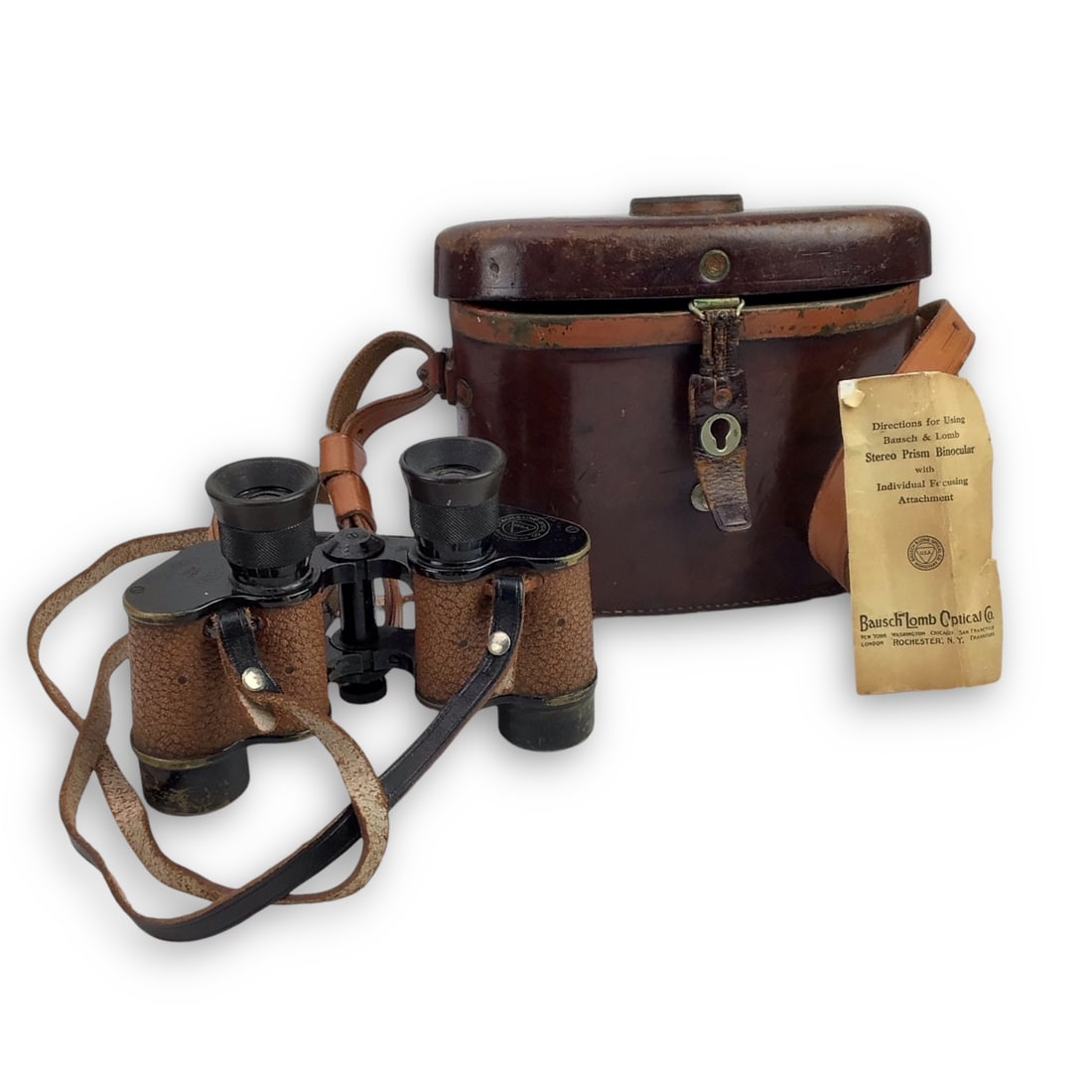 U.S. WW2 Army Bausch & Lomb Stereo Prism Binoculars with Case and Compass: An exceptional and complete example of U.S. WWII Army Bausch & Lomb stereo prism binoculars, housed in the original brown leather case with an integrated compass mounted to the lid. This set retains i