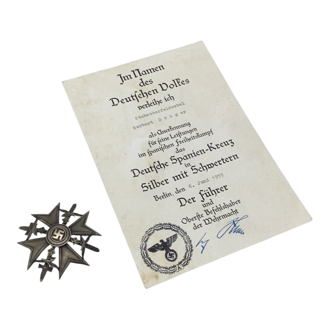 German Legion Condor Panzer Grouping with Spanish Cross in Silver & Signed Award Document: This extraordinary grouping centers on the German Spanish Cross in Silver with Swords, awarded to Stabsoberfeldwebel Herbert Drager of the Legion Condor Panzer forces, and is accompanied by its origin
