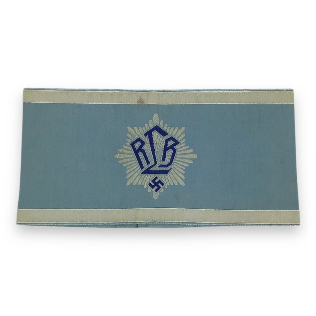 Very Rare German WW2 RLB Officer Armband First Pattern: An exceptionally rare first-pattern German WW2 RLB Officer's Armband (circa 1933-1939), featuring a mid-blue cotton construction with a machine-embroidered RLB emblem at the center. The emblem consist