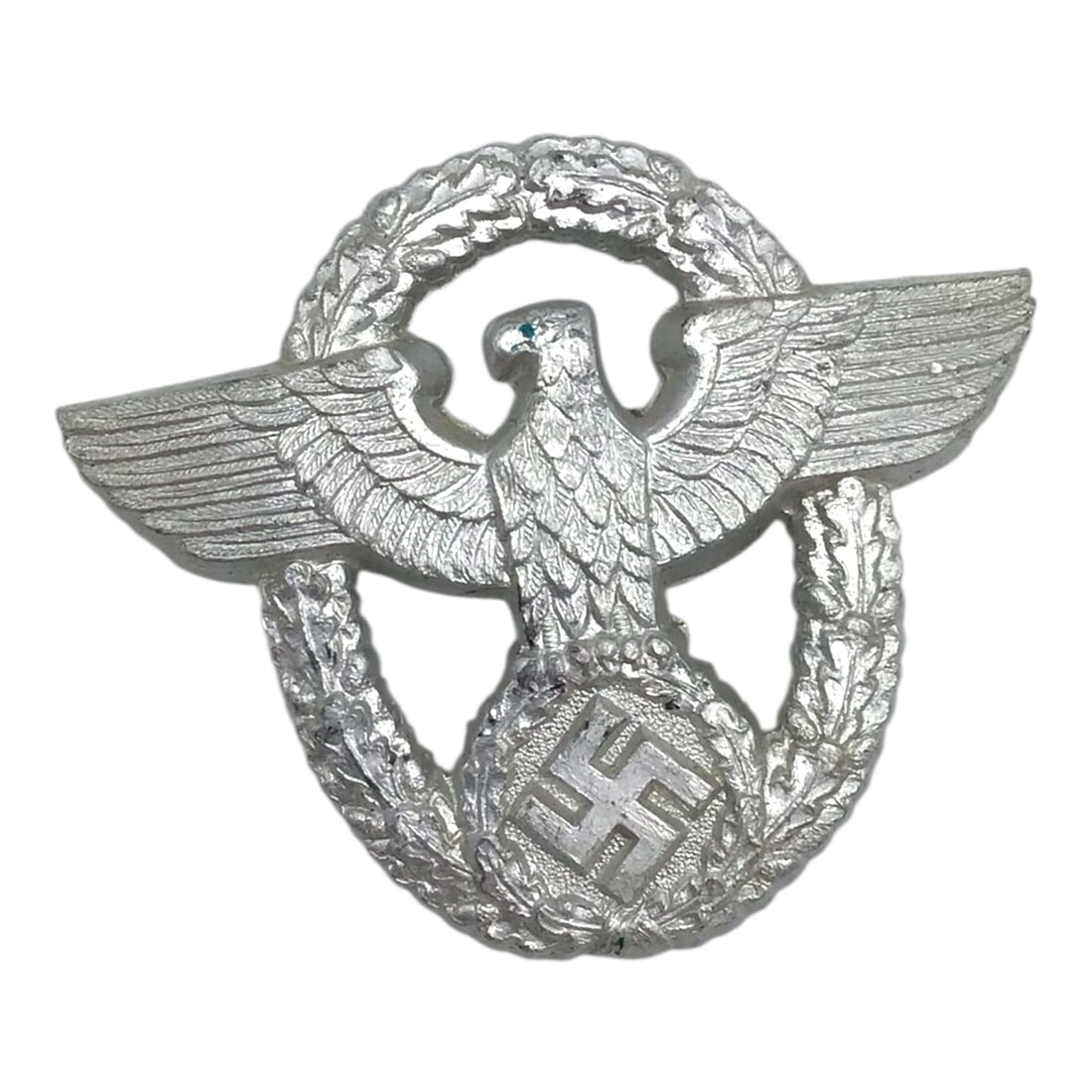 German Police Officer Eagle Cap Badge Silver Hollowback- US Veteran Bringback: This striking German WWII police officer second model cap eagle is a silver-finished hollowback example displaying sharp detail and excellent overall condition. The badge is unmarked, as commonly enco