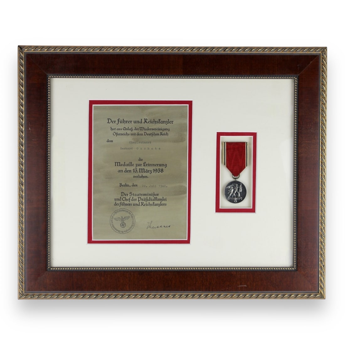 German Austrian Anschluss Medal w/ Award Document: Framed and matted for display, this original German WW2 Anschluss Commemorative Medal award document was issued to First Lieutenant Gerhard Oschatz on July 22, 1940, recognizing his role in the 1938 r