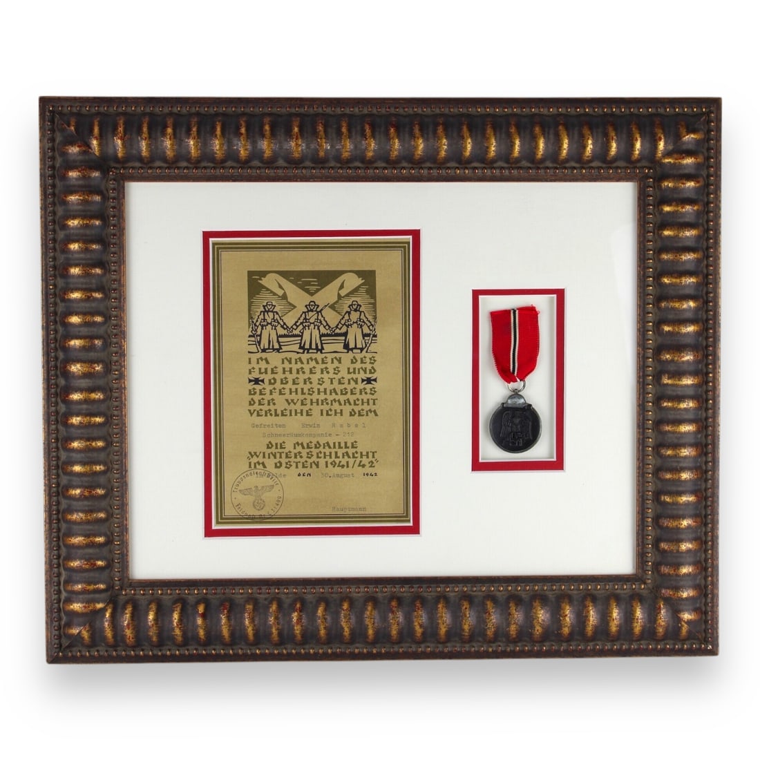 German 1941/42 - Winter Battle in the East Medal & Award Doc to Gefreiter Erwin Rabel | Rare Display: This historically significant German World War II medal, known as the "Frozen Meat Medal", was awarded to Gefreiten Erwin Rabel of Schneeraumkompanie-212 for his service during the Winter Battle in th