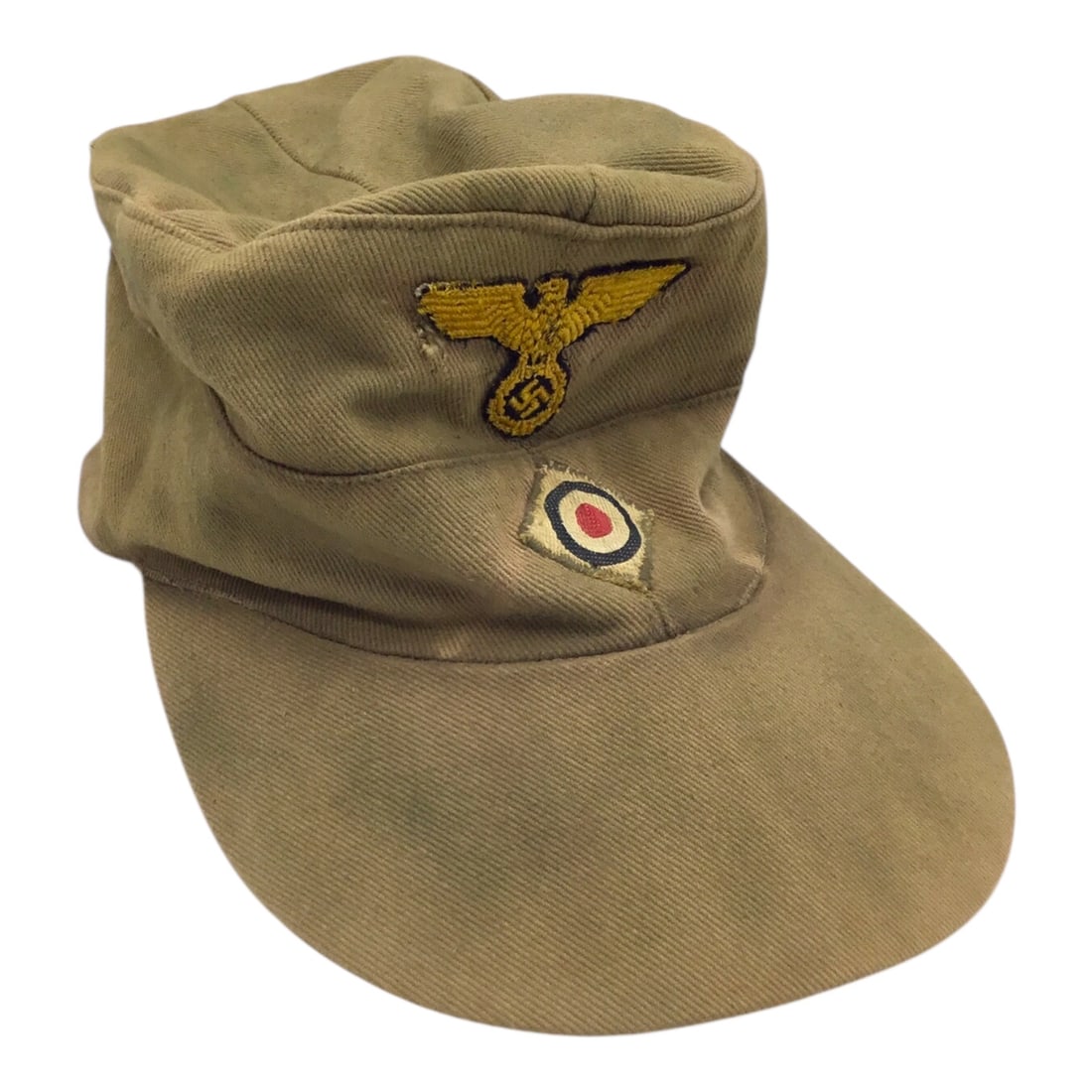 Rare German WW2 Kriegsmarine M41 Tropical Cap Tan Colored with Pink Interior: This rare German WWII Kriegsmarine M41 tropical cap is an original tan-colored example featuring a distinctive pink interior lining. Of particular note, the applied front eagle insignia is the less co