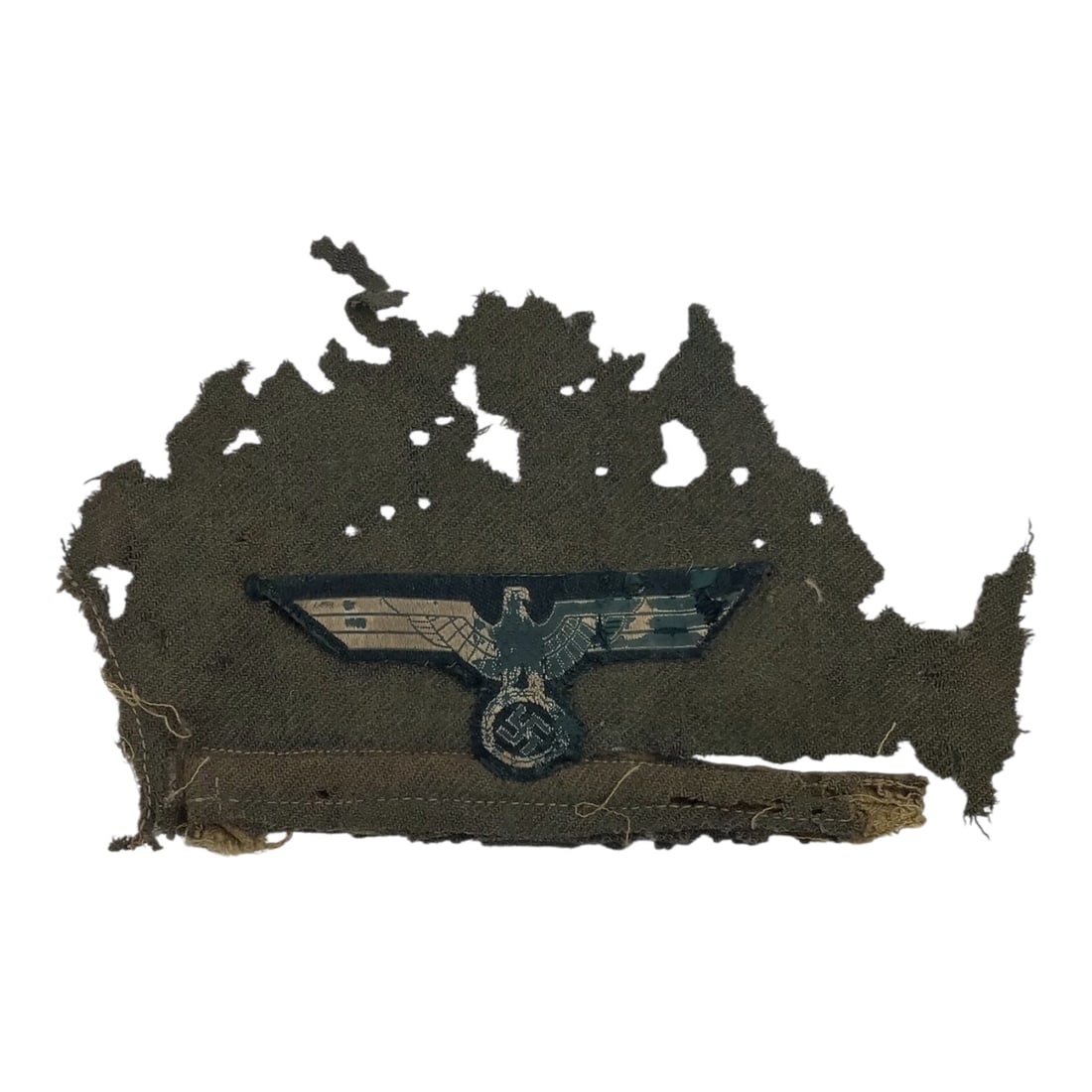 German Heer Breast Eagle Patch Uniform Removed Field Worn Example - WW2: This original German WWII Heer breast eagle patch is a uniform-removed example still attached to a partial swatch of its original tunic fabric. The insignia is in heavily worn, field-used condition, w